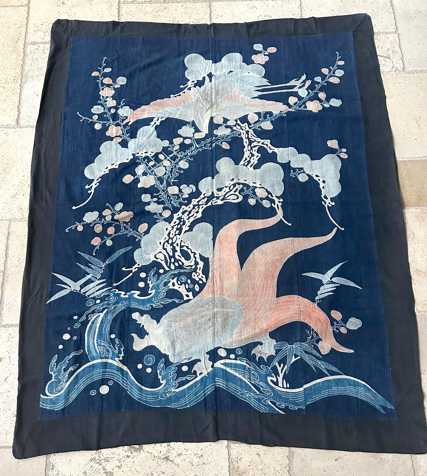 A large unframed Japanese Futonji textile art circa late 19th century toward the end of the Meiji period. Seamed together from four vertical sections of cotton in deep indigo color, this large piece was made as a Futonji (futon cover) or Yutan