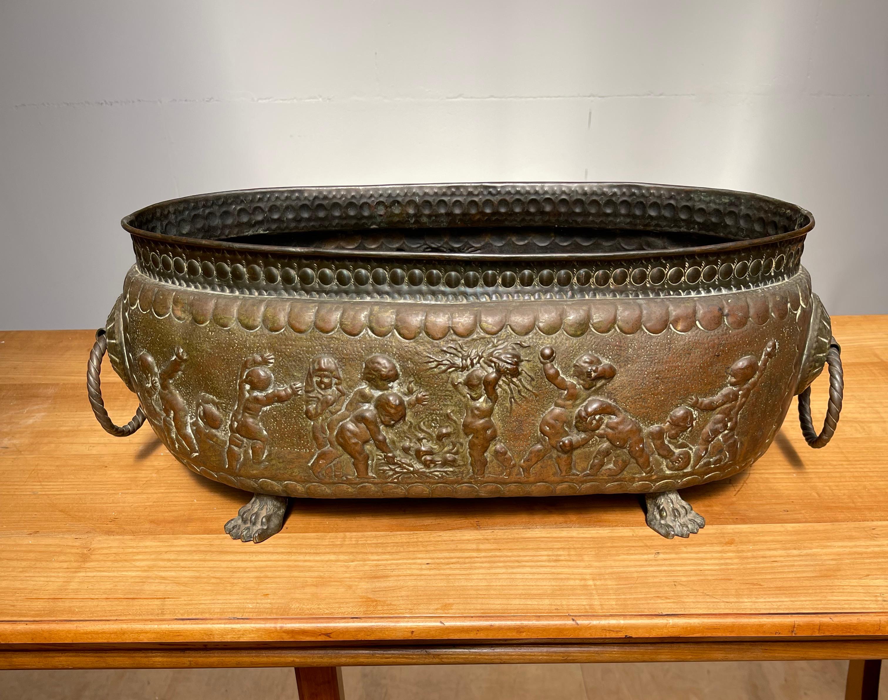 Renaissance Revival Antique Large Jardiniere / Planter Embossed with Putti Sculptures in Deep Relief For Sale