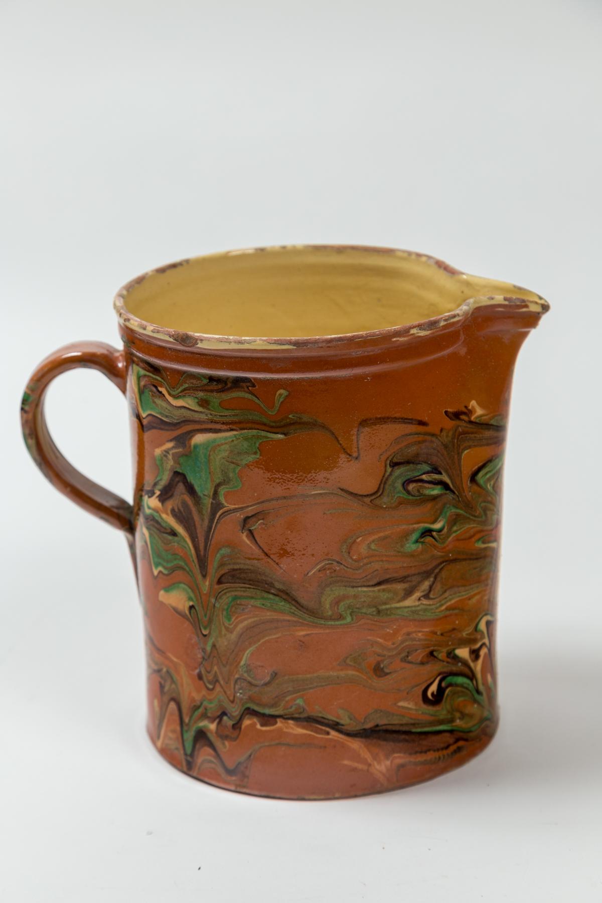 Antique Large Jaspé Pottery Pitcher, Late 19th Century, France. An exceptionally large size pitcher with striking marbleized slip application. From the Savoie region of France.