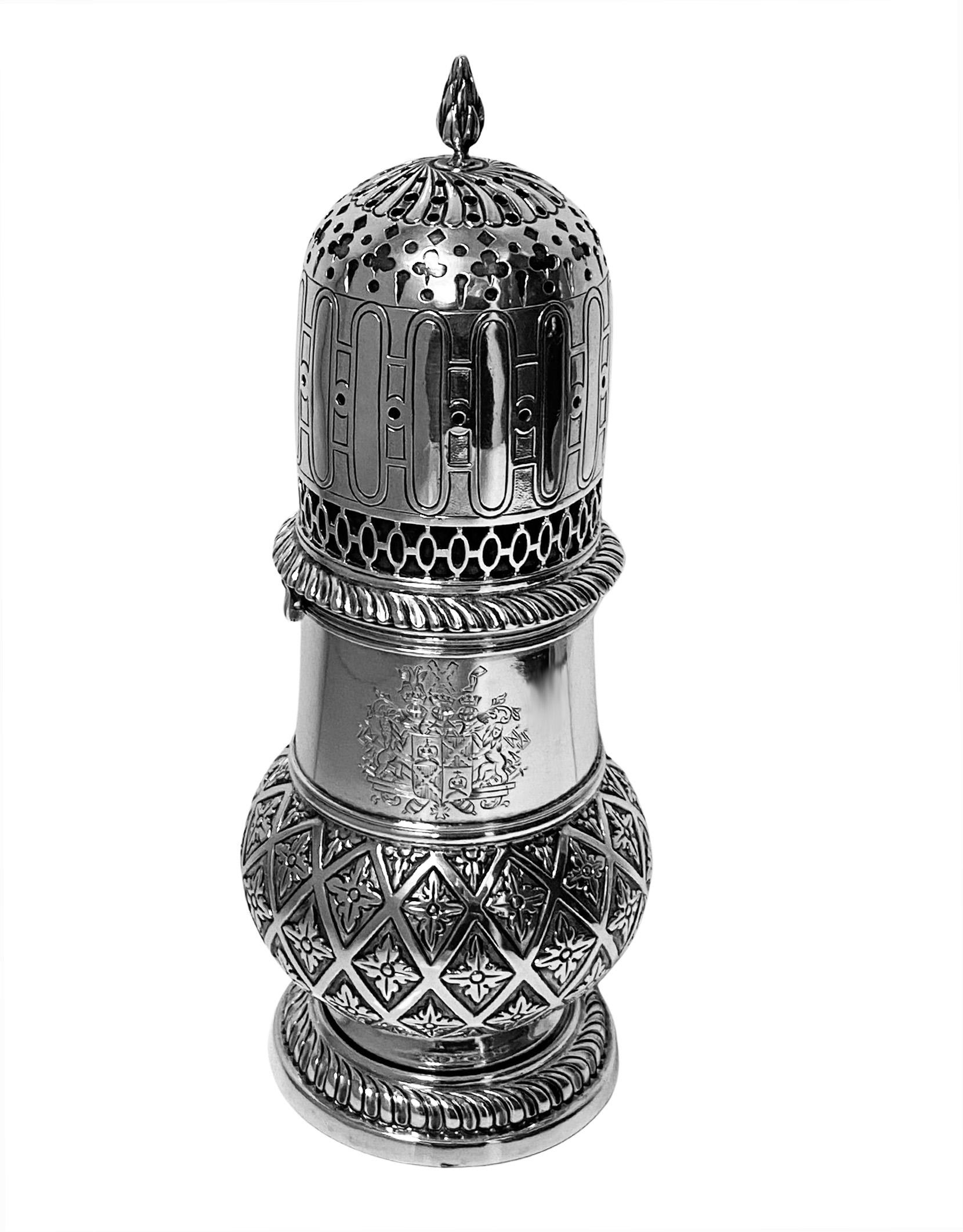 Antique large late 19th century Dutch Silver Caster. Early 18th century style, pierced and fluted cover with bayonet fitting, engraved with elaborate coat of arms, the lower body engraved with diaperwork enclosing foliate moifis surround on stippled