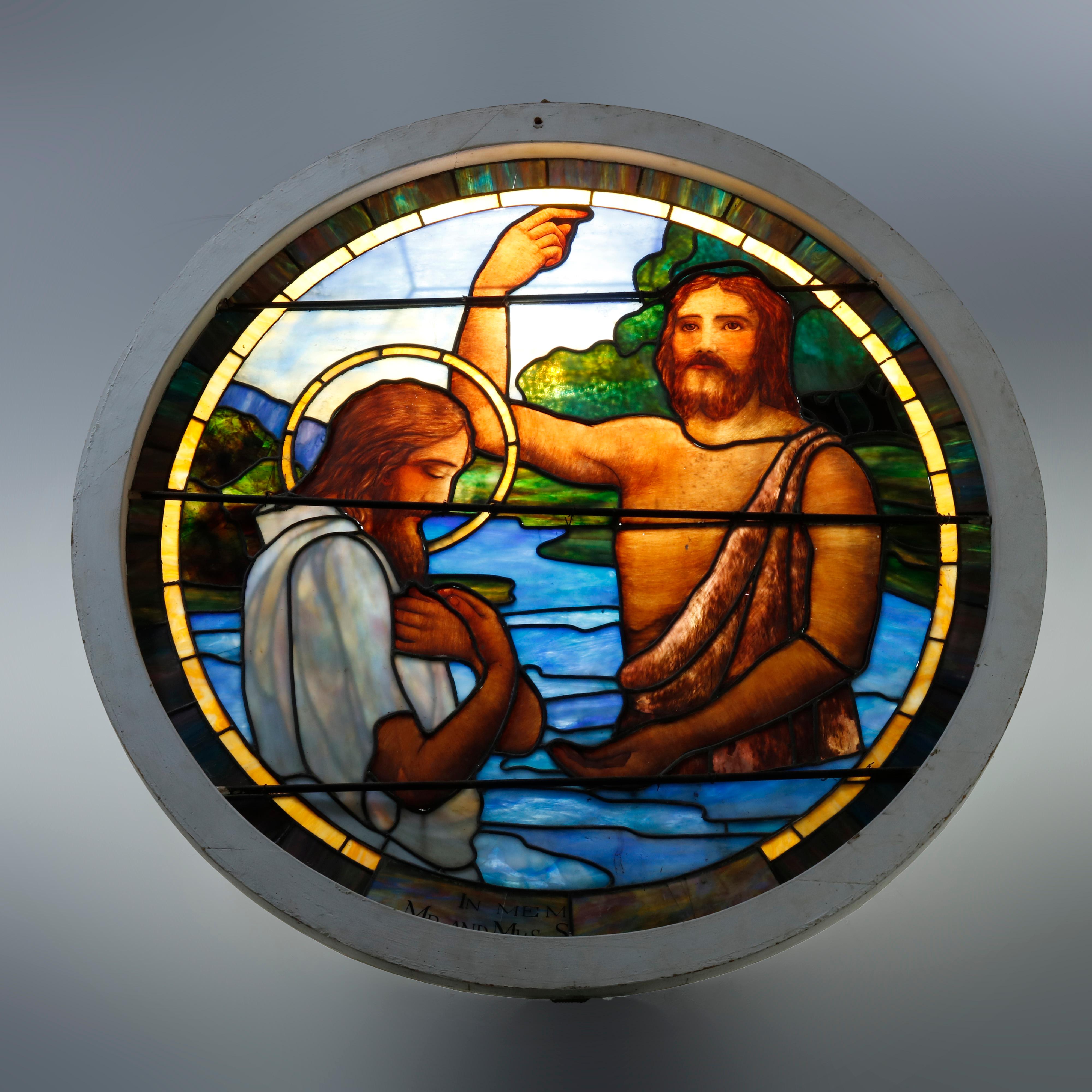 An antique and large leaded stained and painted glass window offers circular form and depicts Christ's baptism, c1890.

Measures: 52.75