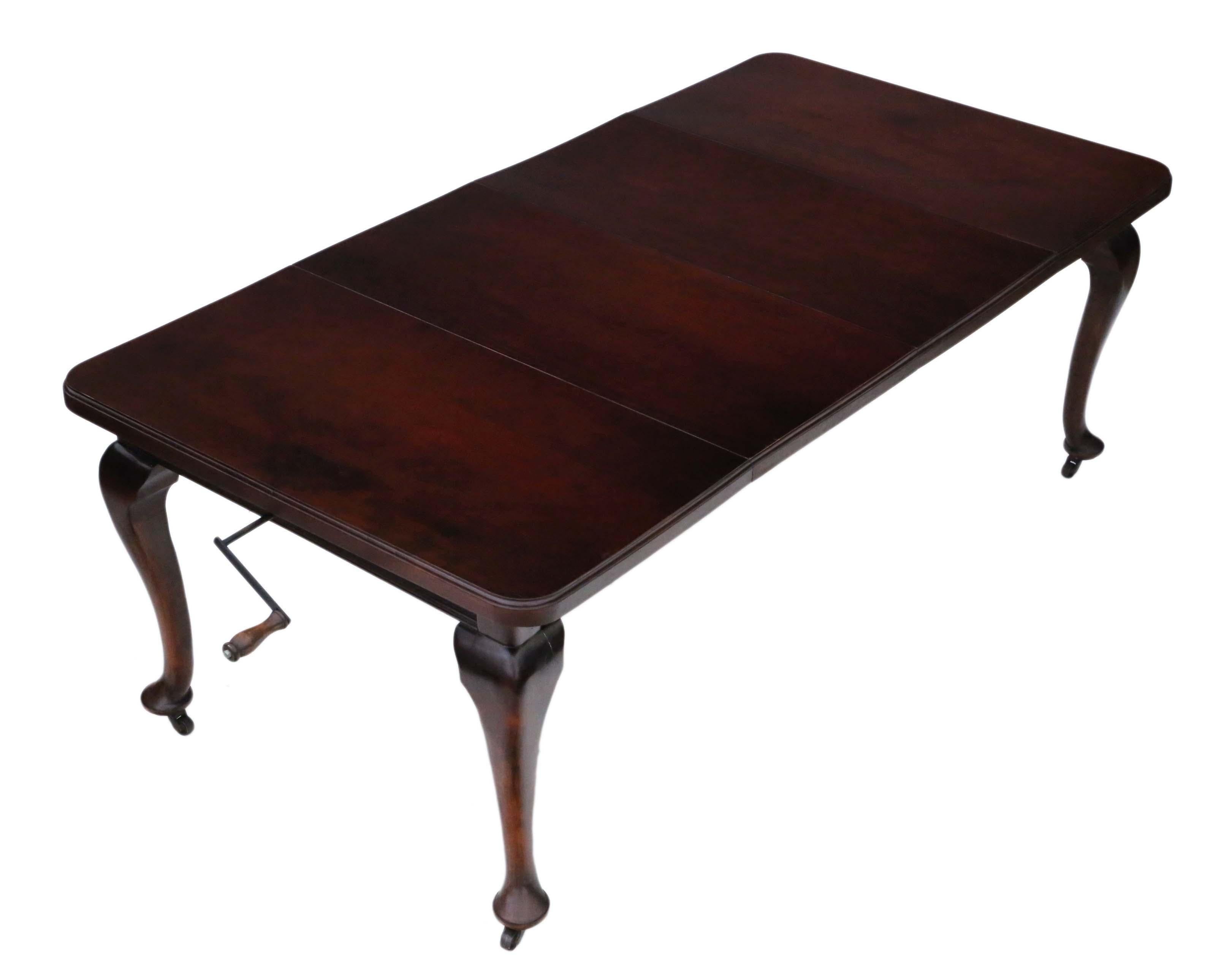 Antique large 2-leaf mahogany wind-out extending dining table. Measures: 6'8