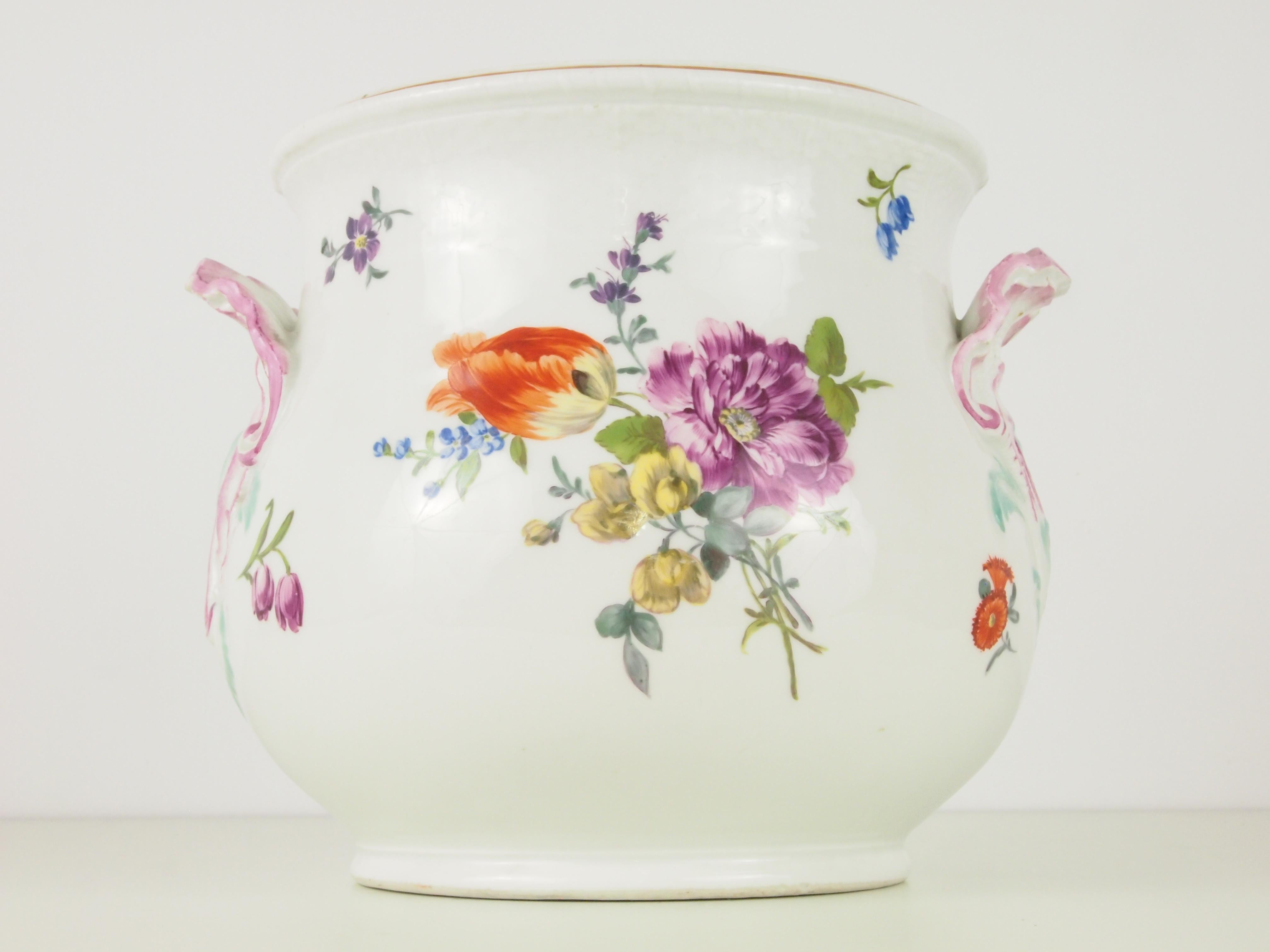 Large antique cache pot by Meissen from the Marcolini period (1774-1814). Decorated with hand painted loose bouquets of flowers and scattered sprigs. The handles have the shape of shells or flower leaves decorated with rims in pink and pastel