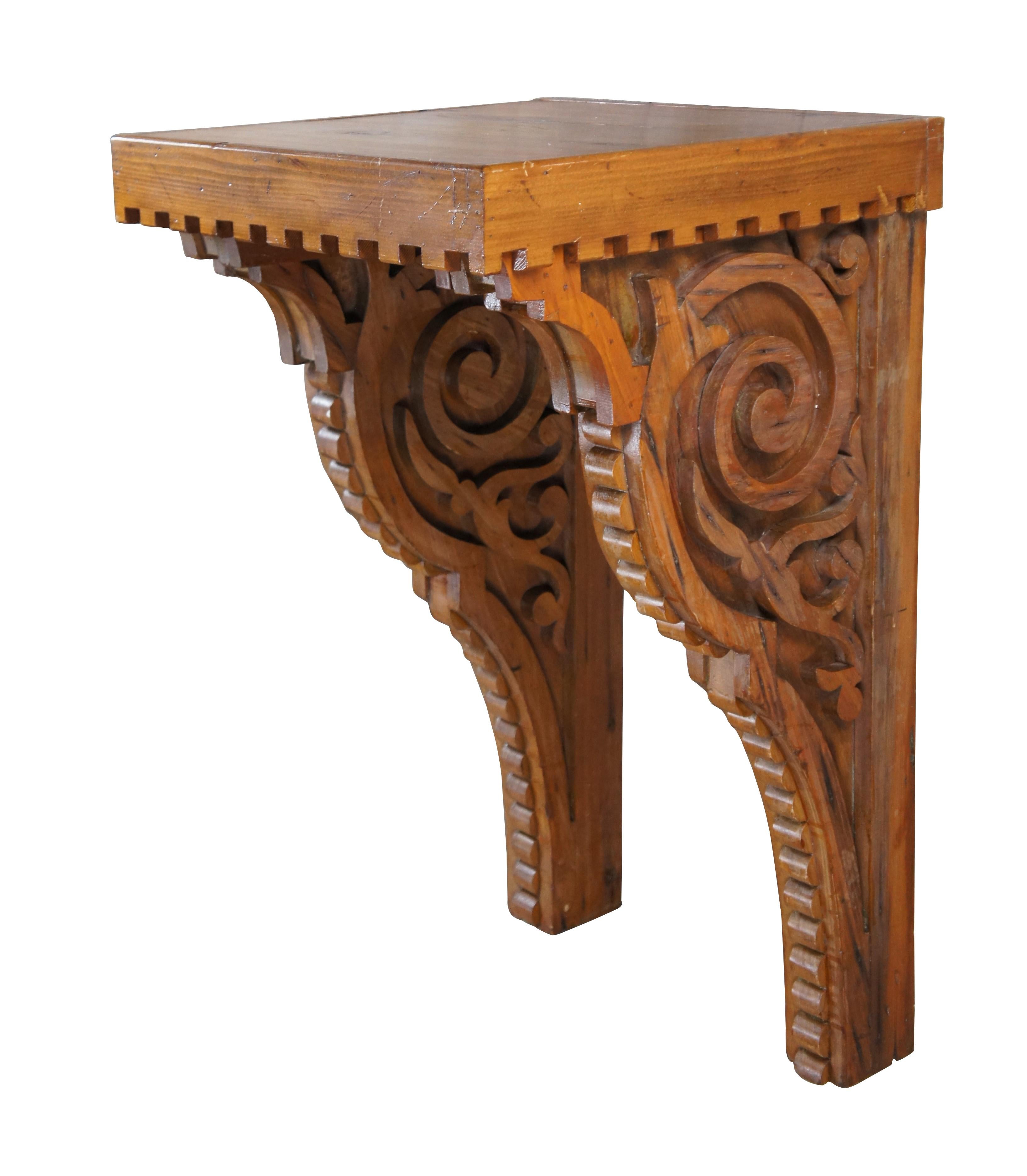 A large and impressive antique reclaimed altar wall shelf / sconce / corbel / or bracket.  Made of pine featuring ornate sawtooth and scrolled design 

Dimensions:
37.5