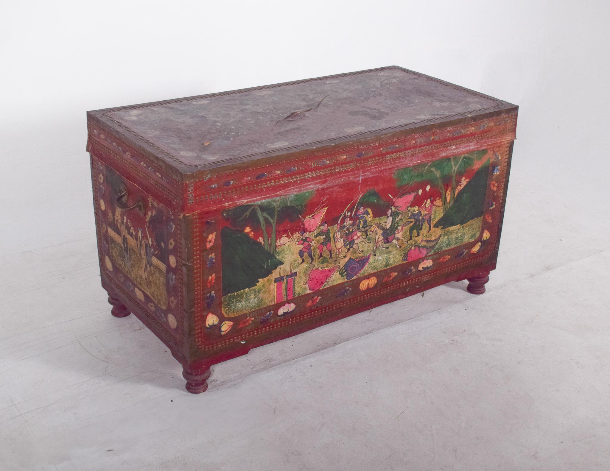 Large oriental chest painted red, with figures. Finished in red and hand-painted to depict figurative scenes and landscapes, possibly of Asian origin or oriental influence. The chest is rectangular in shape, with a hinged top lid and ample internal