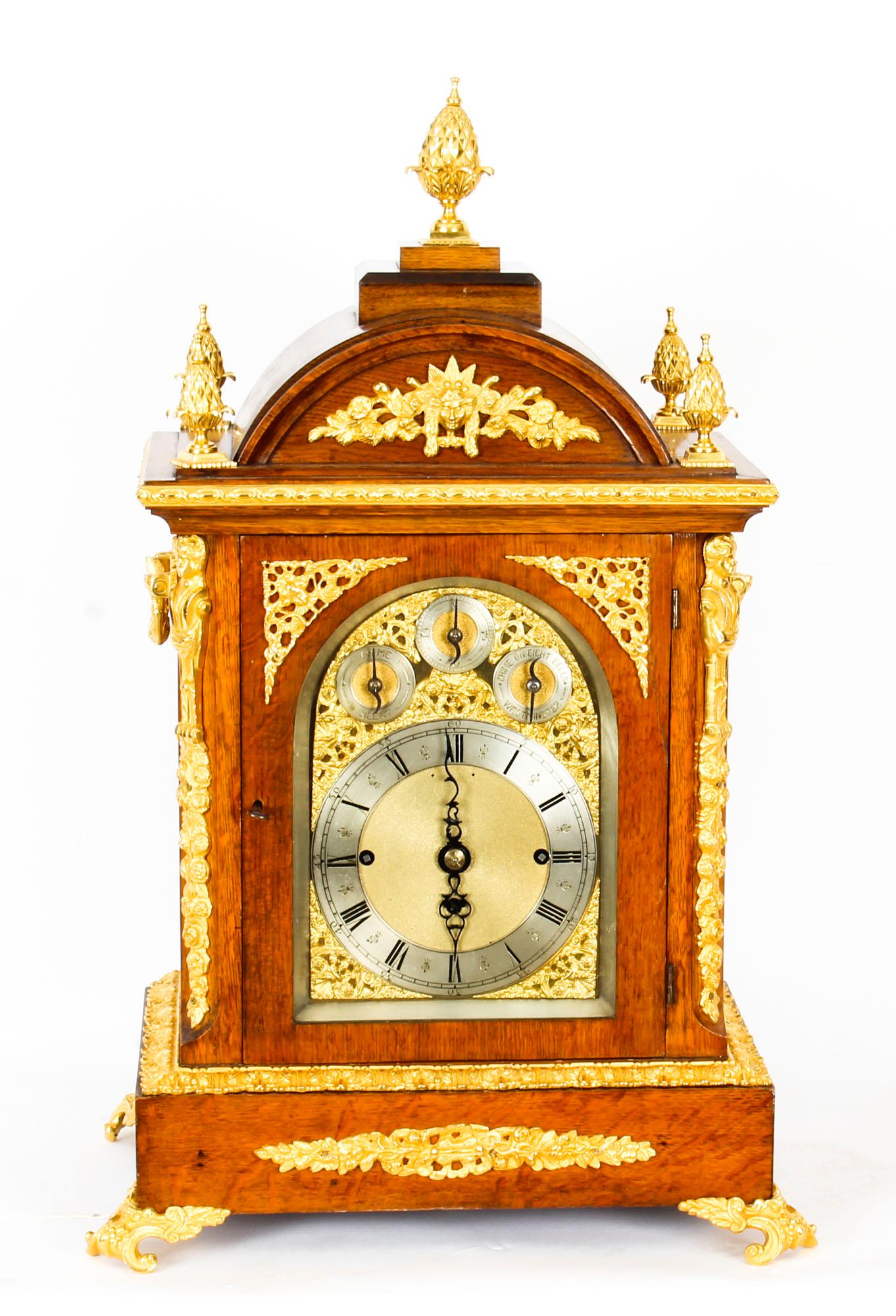 A stunning 19th century ormolu mounted quarter chiming bracket clock of large size. 
The case decorated with five pineapple finials and ribbon-tied foliate festoons, above an ormolu mounted glazed door. This is flanked by a caryatid to each corner,