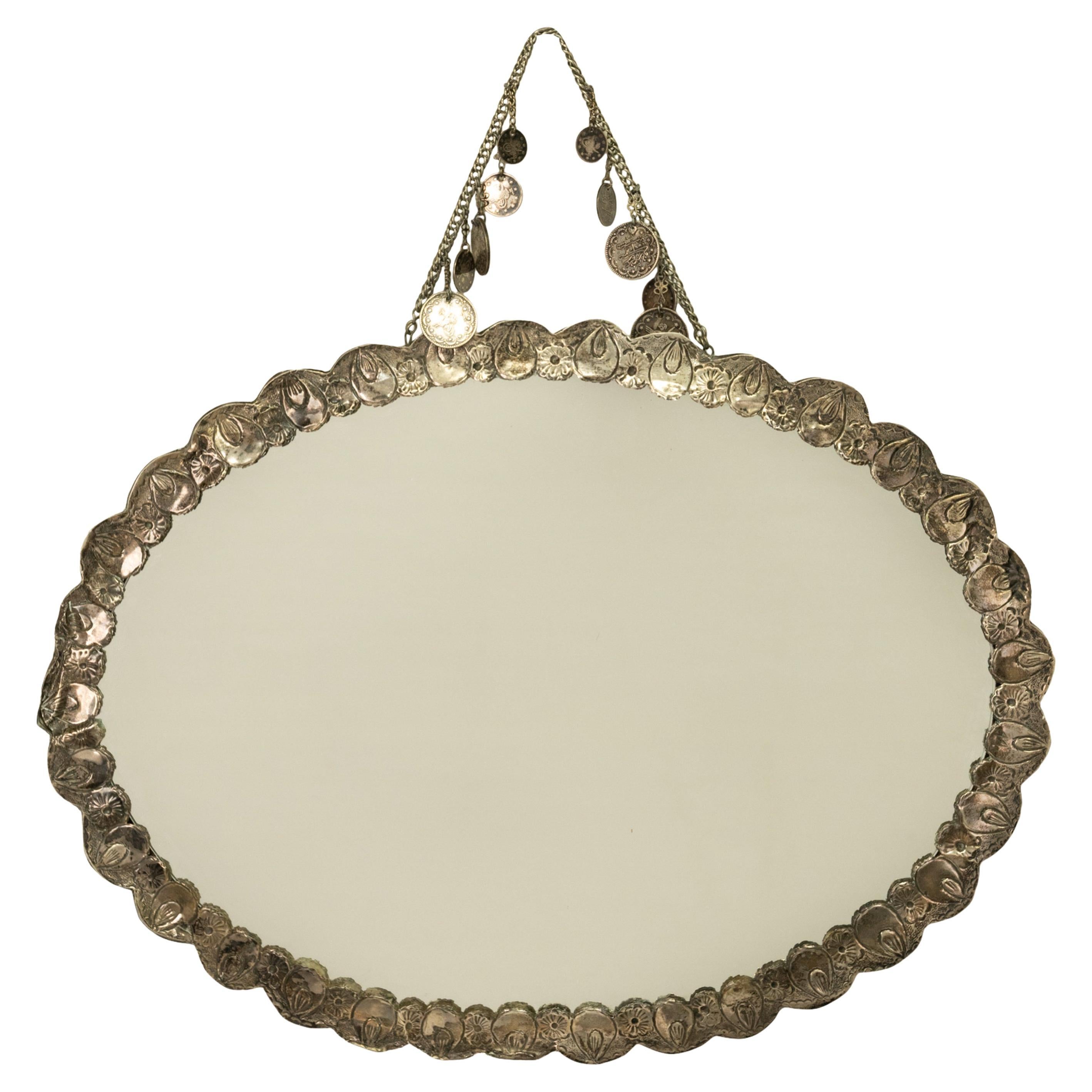 A good & large antique 19th century Ottoman silver wedding/wall mirror, with ten Ottoman Turkish Lira coins in three denominations & each dated with the Hijri date of 1327, which equates to the year 1909 in the Western calendar .

The mirror is of 