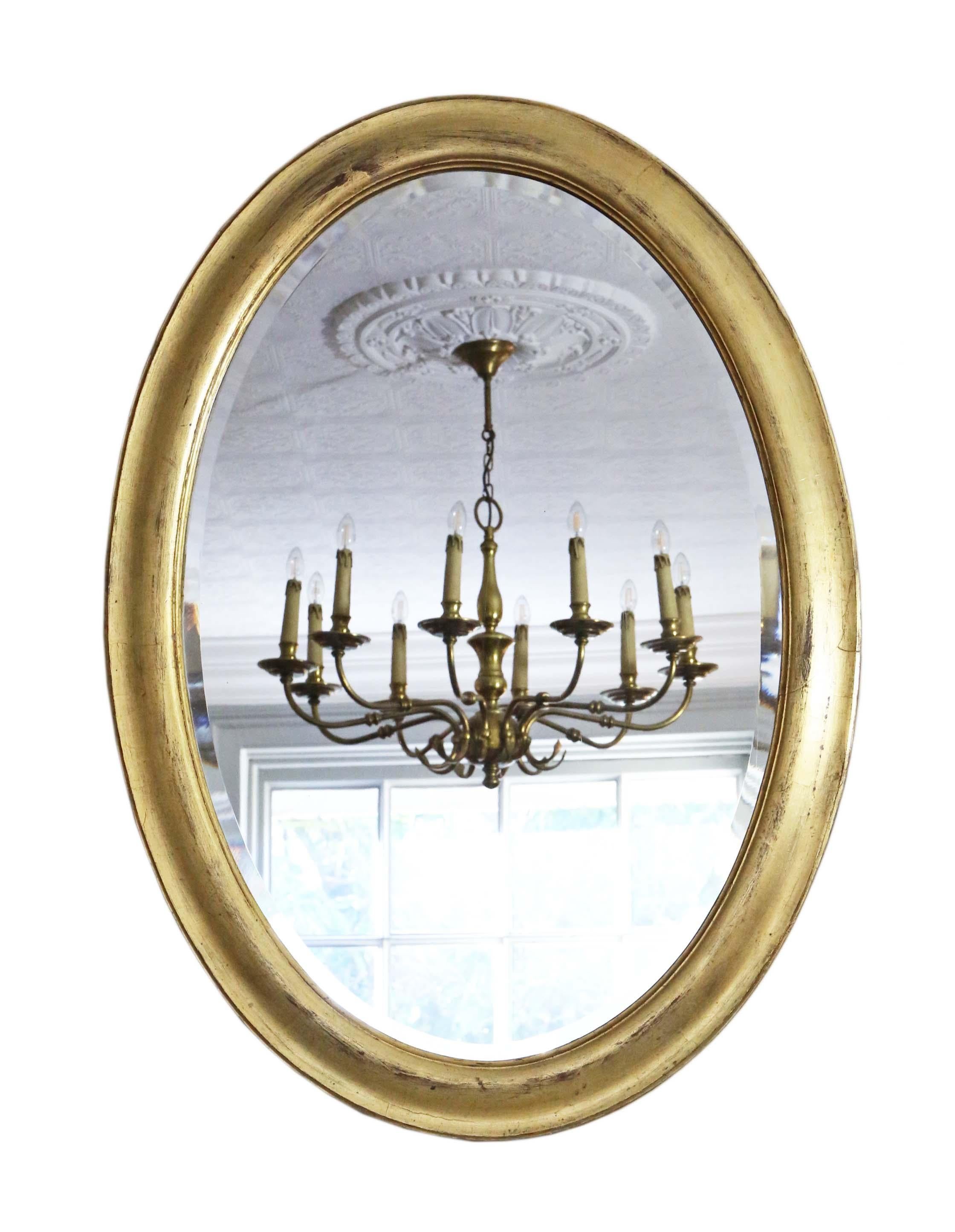 Antique large quality oval gilt wall mirror overmantle 19th Century.

An impressive rare find, that would look amazing in the right location. Could be used in portrait or landscape. No loose joints or woodworm.

The original bevel edge mirrored