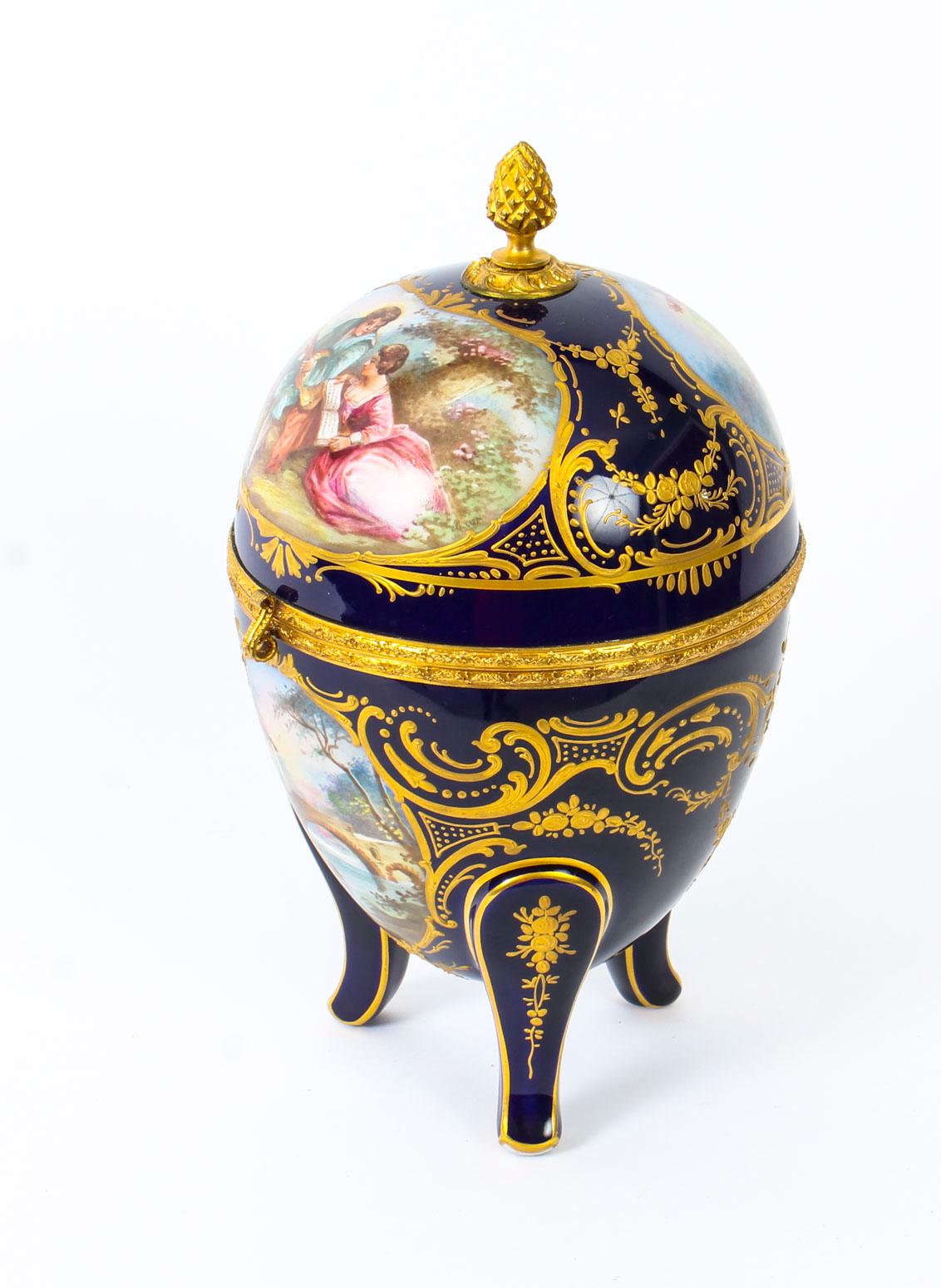 This is an exquisite French antique ormolu-mounted Sèvres Porcelain casket, circa 1880 in date.
 
This wonderful large casket is ovoid in shape and has a stunning hinged lid with a pineapple finial featuring two beautiful hand painted romantic