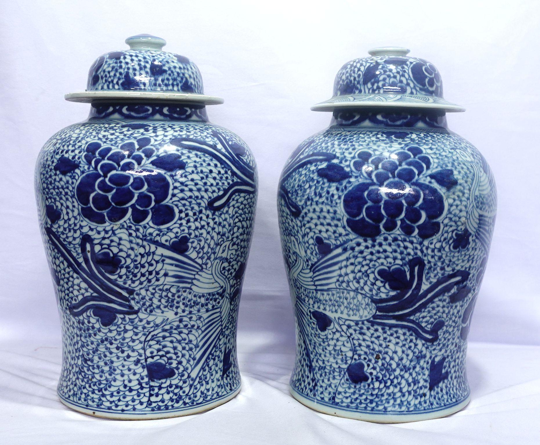 This is a large pair of porcelain Temple Jars with the original lids. The theme is dominated by the symbolic patterns of phoenixes and peonies presenting a luxurious rich life and noble reputation. They are dated from the 19th century. They are