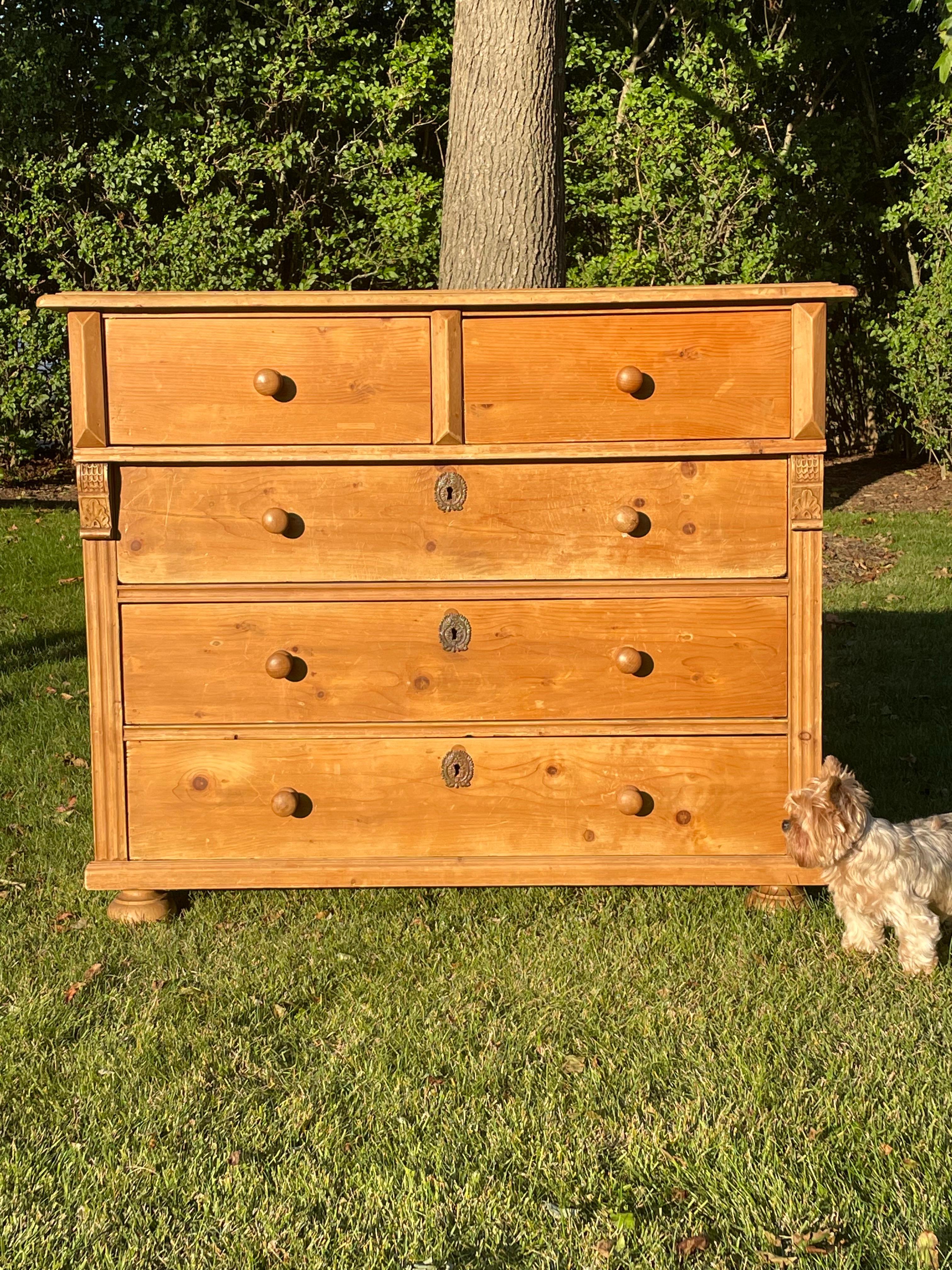 This handsome antique large dresser has two smaller drawers on top and three large drawers for lots of storage . The dresser is very sturdy and well constructed in dove tail joinery. All drawers open and close smoothly . Nice size and nice patina . 