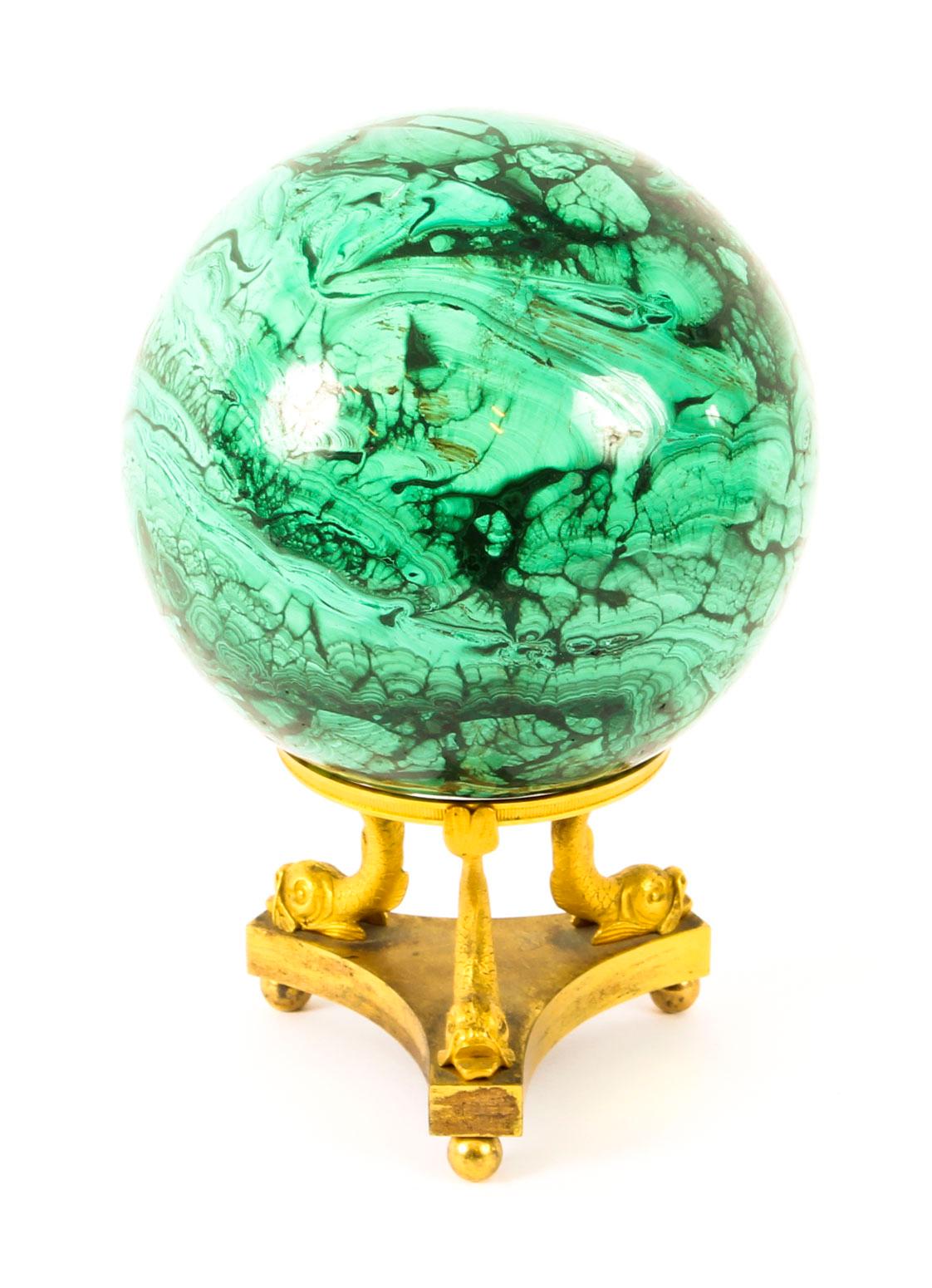 This is a superb large malachite sphere with a decorative ormolu support, circa 1860 in date.

This beautiful malachite sphere features the distinctive textured pattern of the green polished stone.

It stands on a superb ormolu openwork support