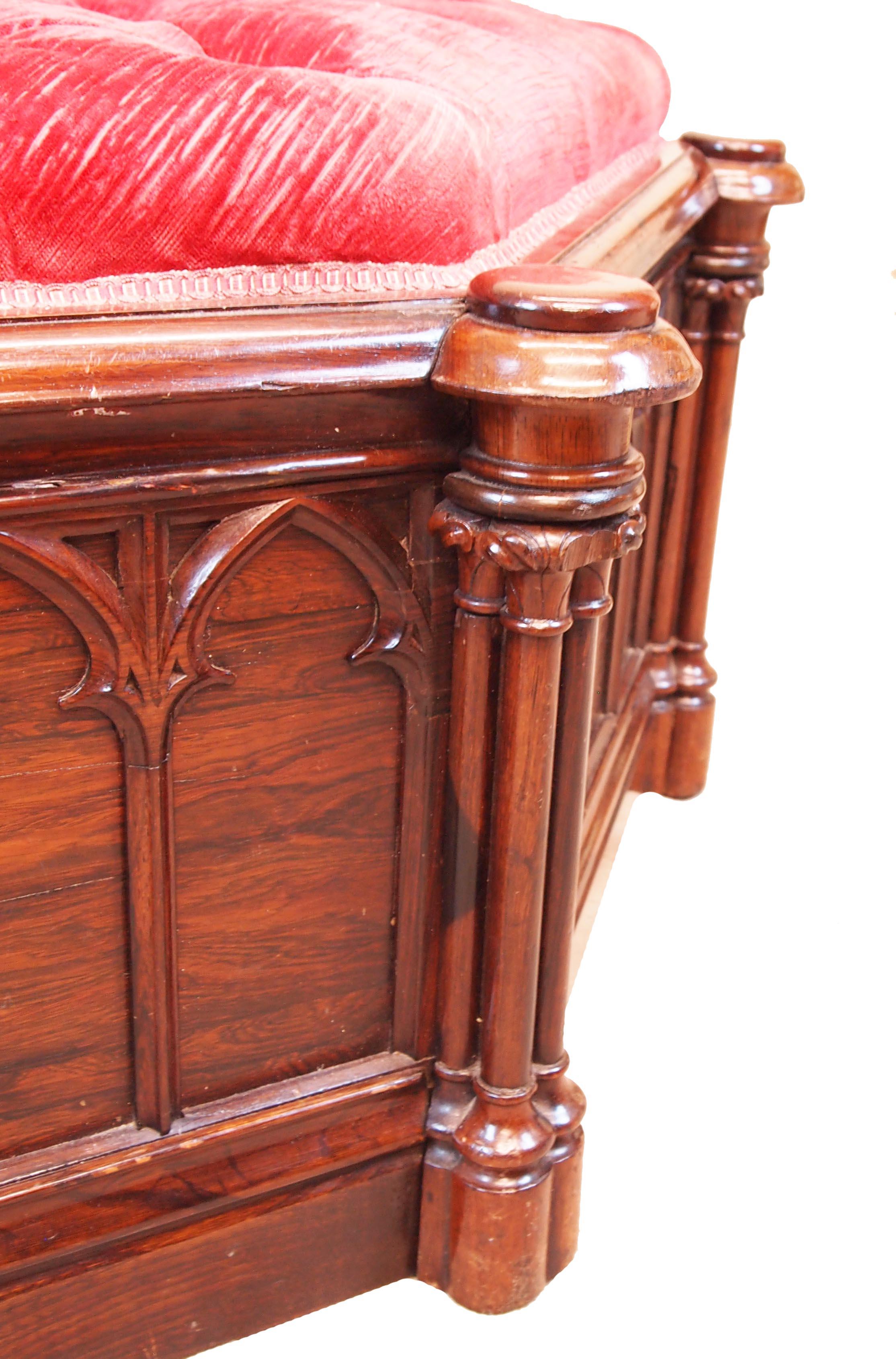 An extremely unusual William IV period octagonal rosewood
centre stool, or ottoman, of very large proportions having
Gothic carved decoration and turned cluster columns.