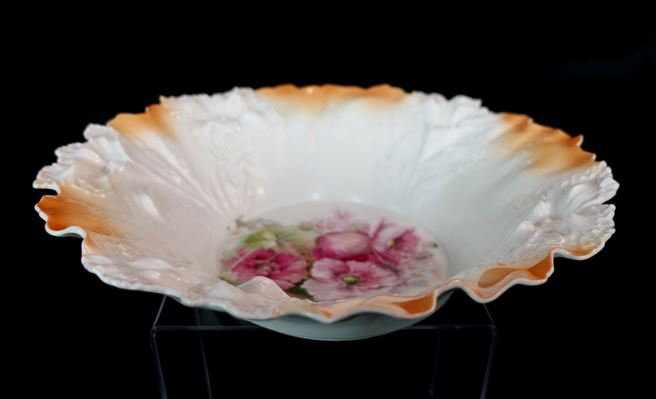 A wonderful RS Prussia German porcelain bowl in lovely multi-colors, the center of the bowl has beautiful many flowers especially, the roses also presenting in different colors, a very adorable artwork.
 