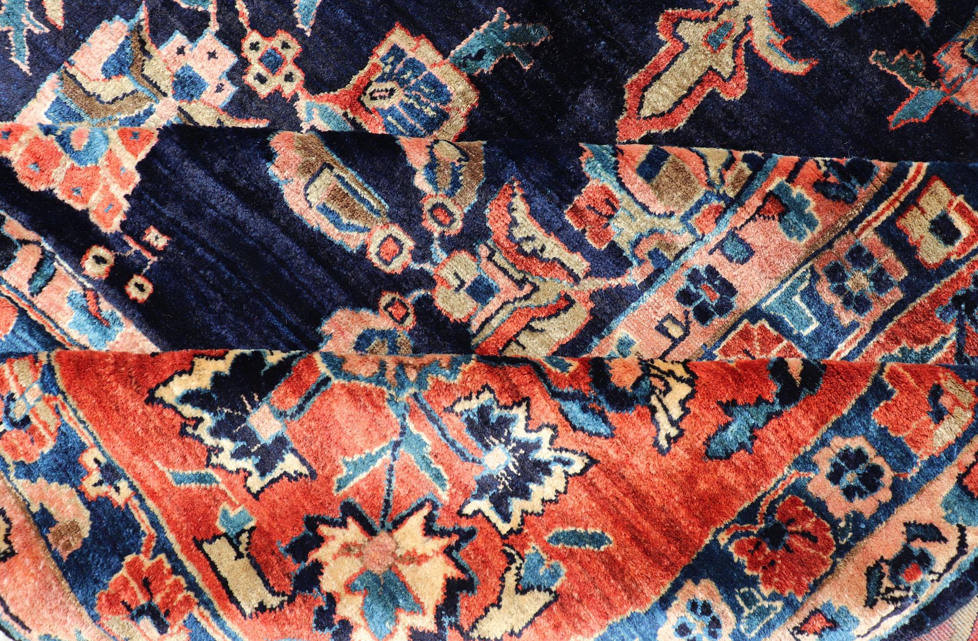 20th Century Antique Large Sarouk Faraghan Rug with Floral Pattern in Navy and Orange-Red For Sale