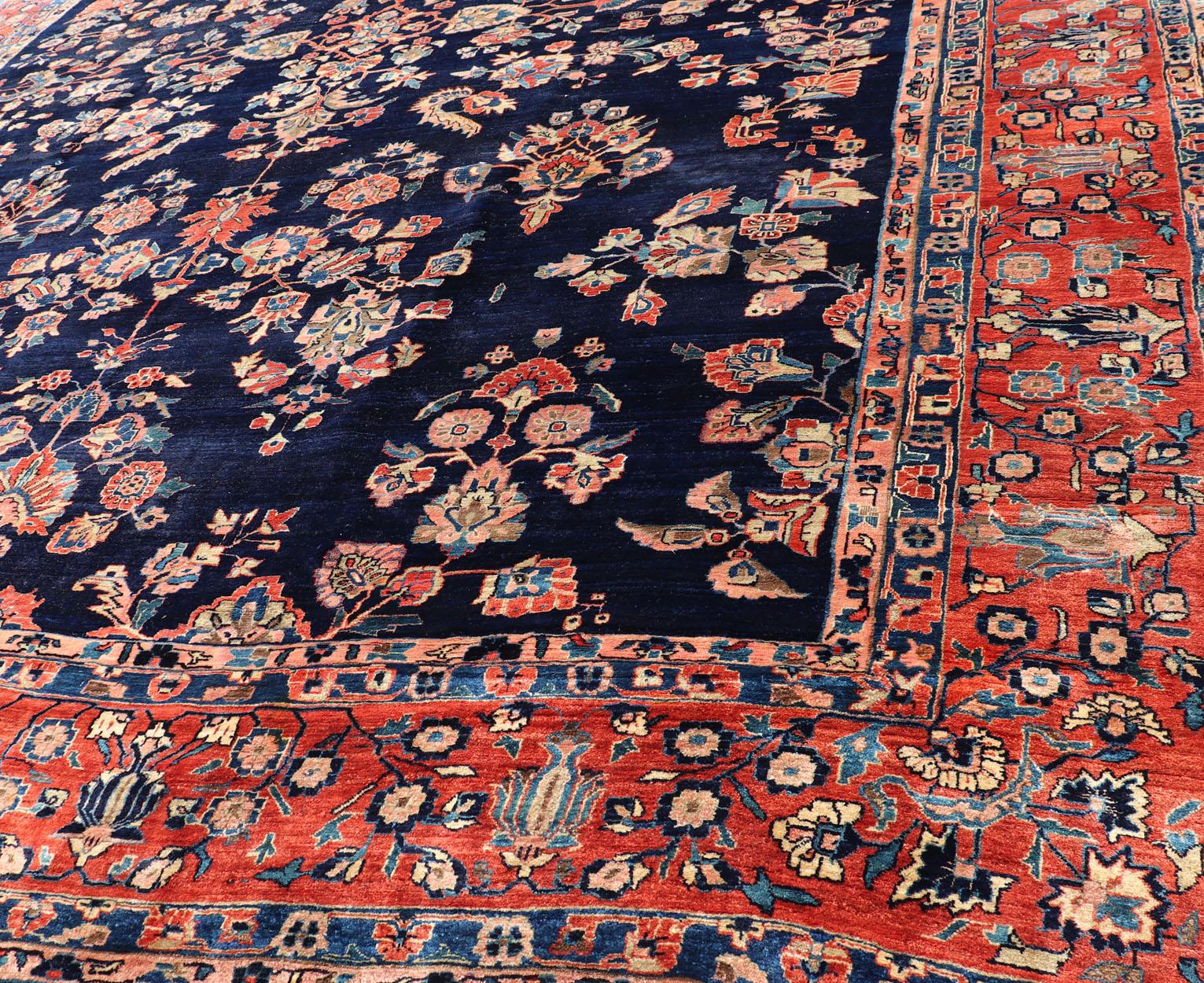 Wool Antique Large Sarouk Faraghan Rug with Floral Pattern in Navy and Orange-Red For Sale