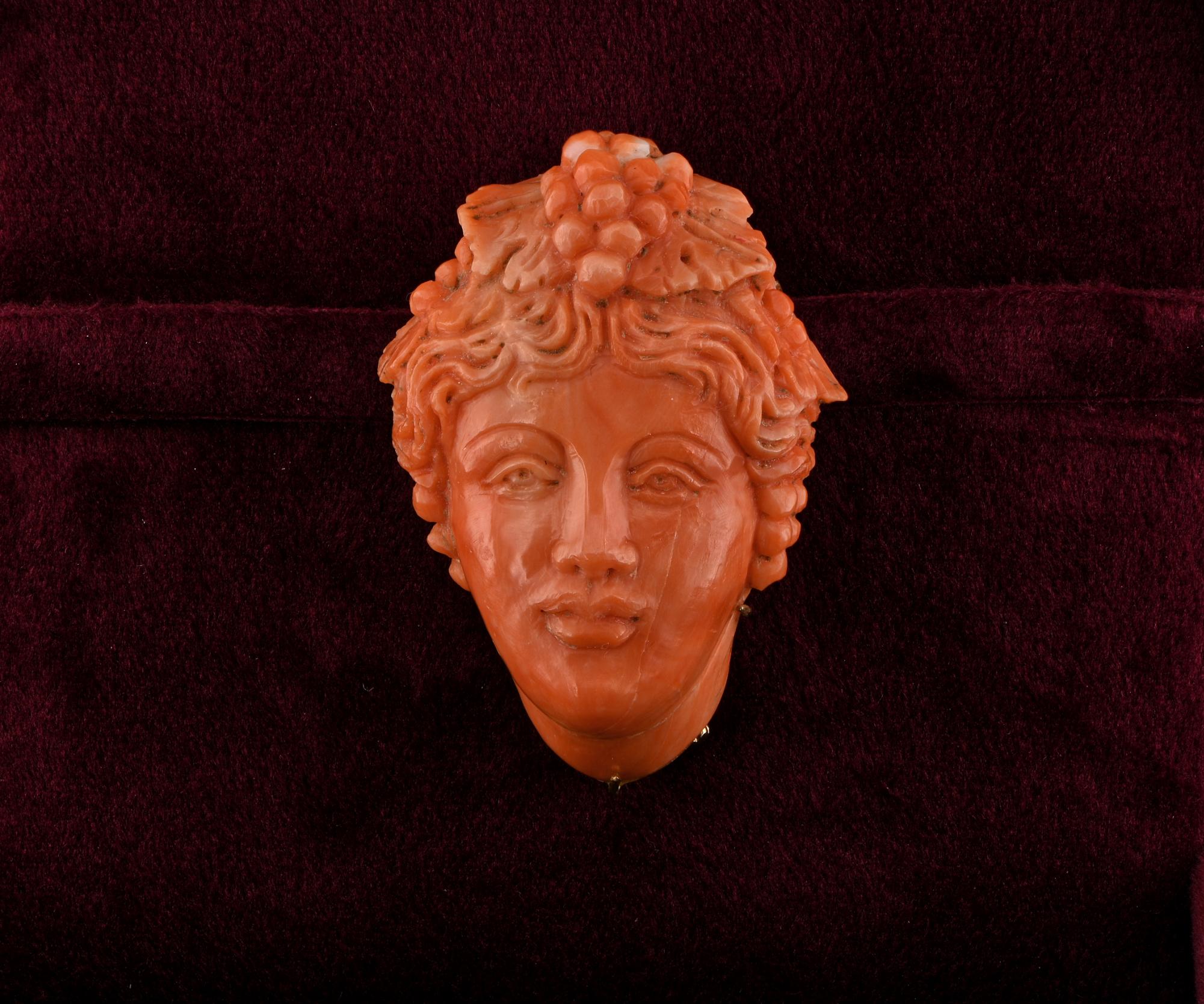 Coral Timeless Seduction
This absolutely superb antique Coral brooch is 1860/70 ca
Spectacular and important antique art piece of pretty large scale, skilfully hand carved during the time featuring the most beautiful Baccante face with rich waved