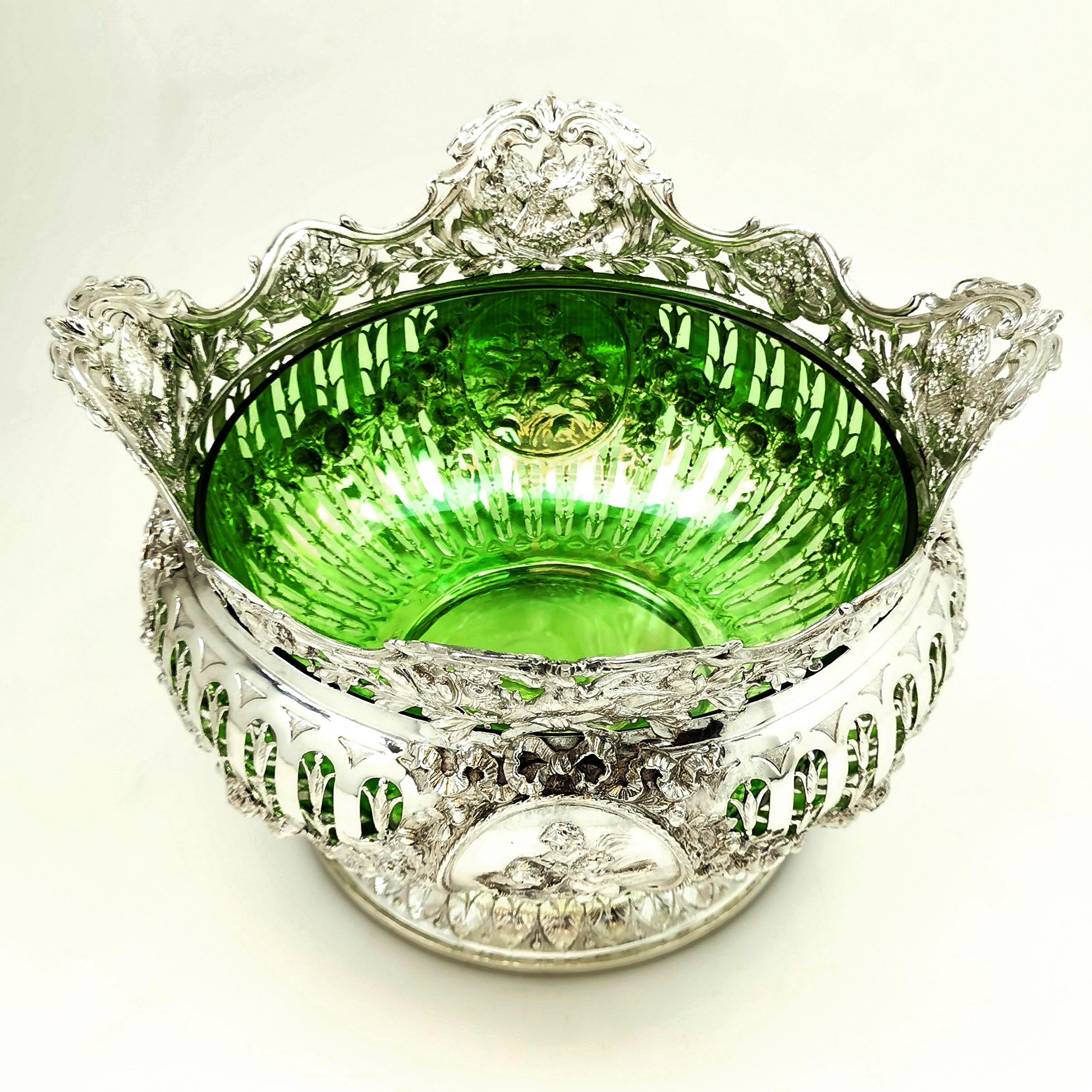 A beautiful antique German solid Silver Bowl with a fitted rich green glass liner. This Bowl has an ornate chased and pierced pattern allowing the green colour to shine through, although the Bowl could be used without the liner if desired. The Bowl