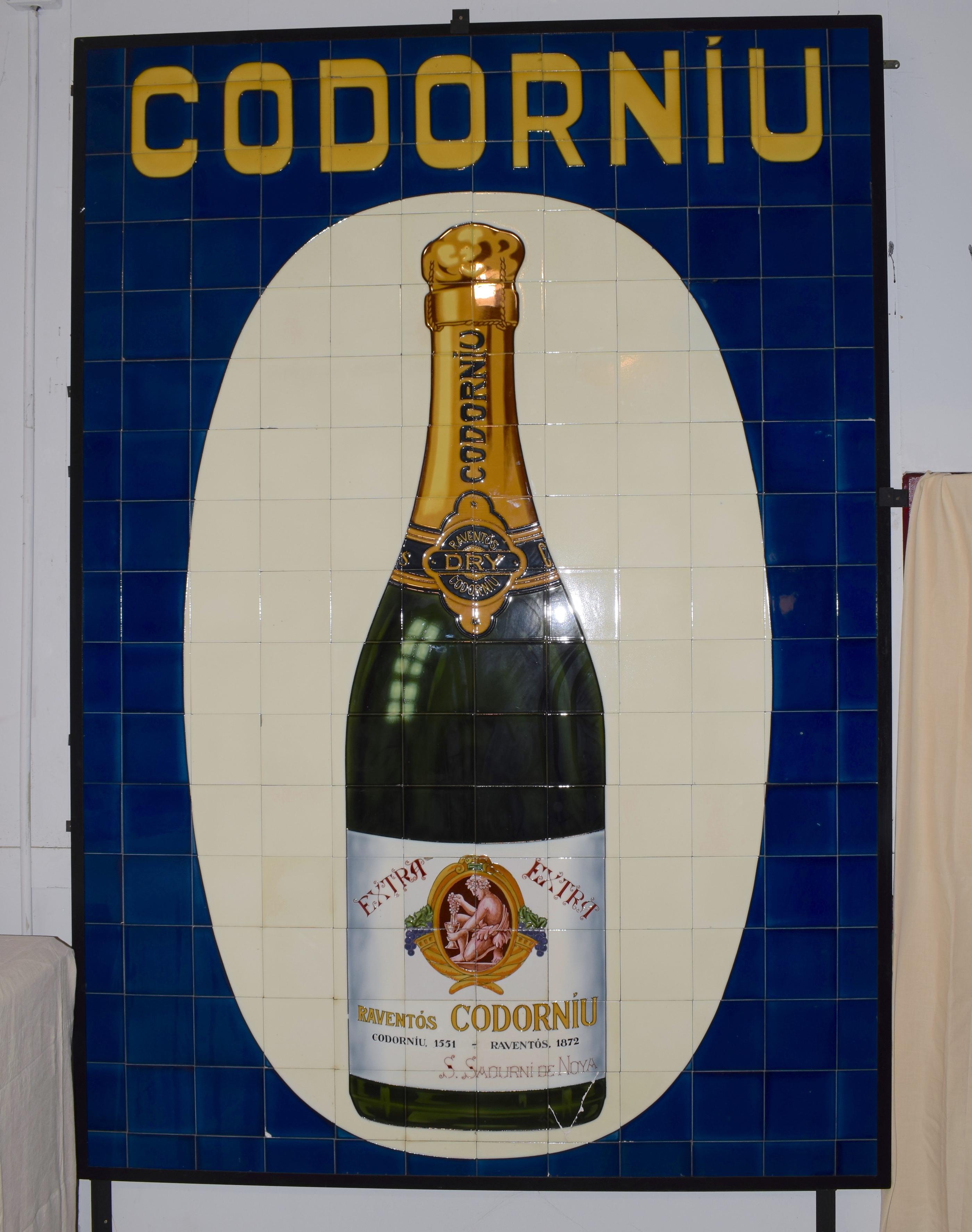This large advertising panel for Codorniu cava was designed during the 1930s and it clearly symbolises Art Nouveau design. It consists of 20cm by 20cm tiles. This panel was part of an architectural salvage project undertaken by ourselves and clearly