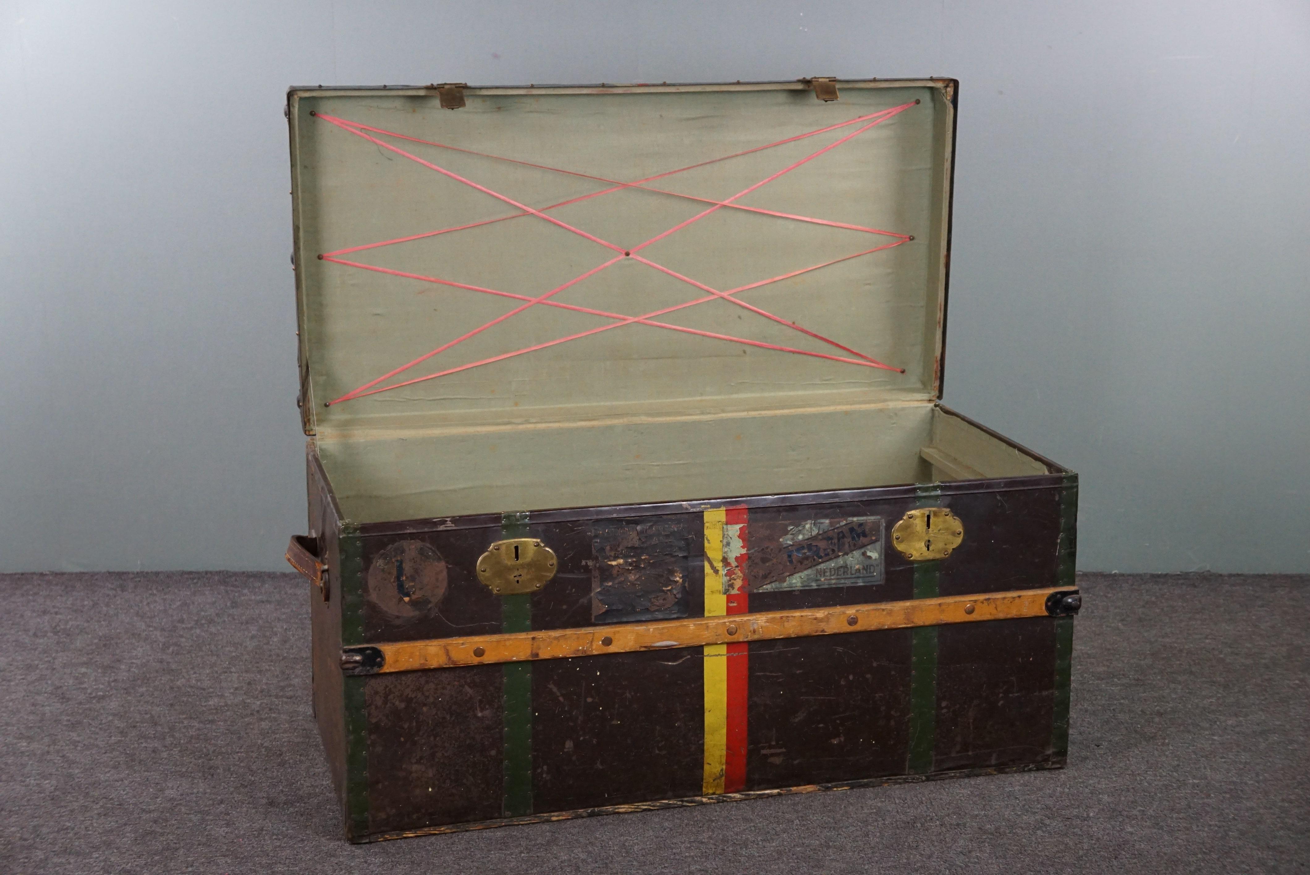 Offered is this wonderfully charming large antique suitcase/ chest with fantastic colors and original labels. A delightful large antique chest for enthusiasts. This charming item can be used for decoration, as a coffee table or low cabinet, or,