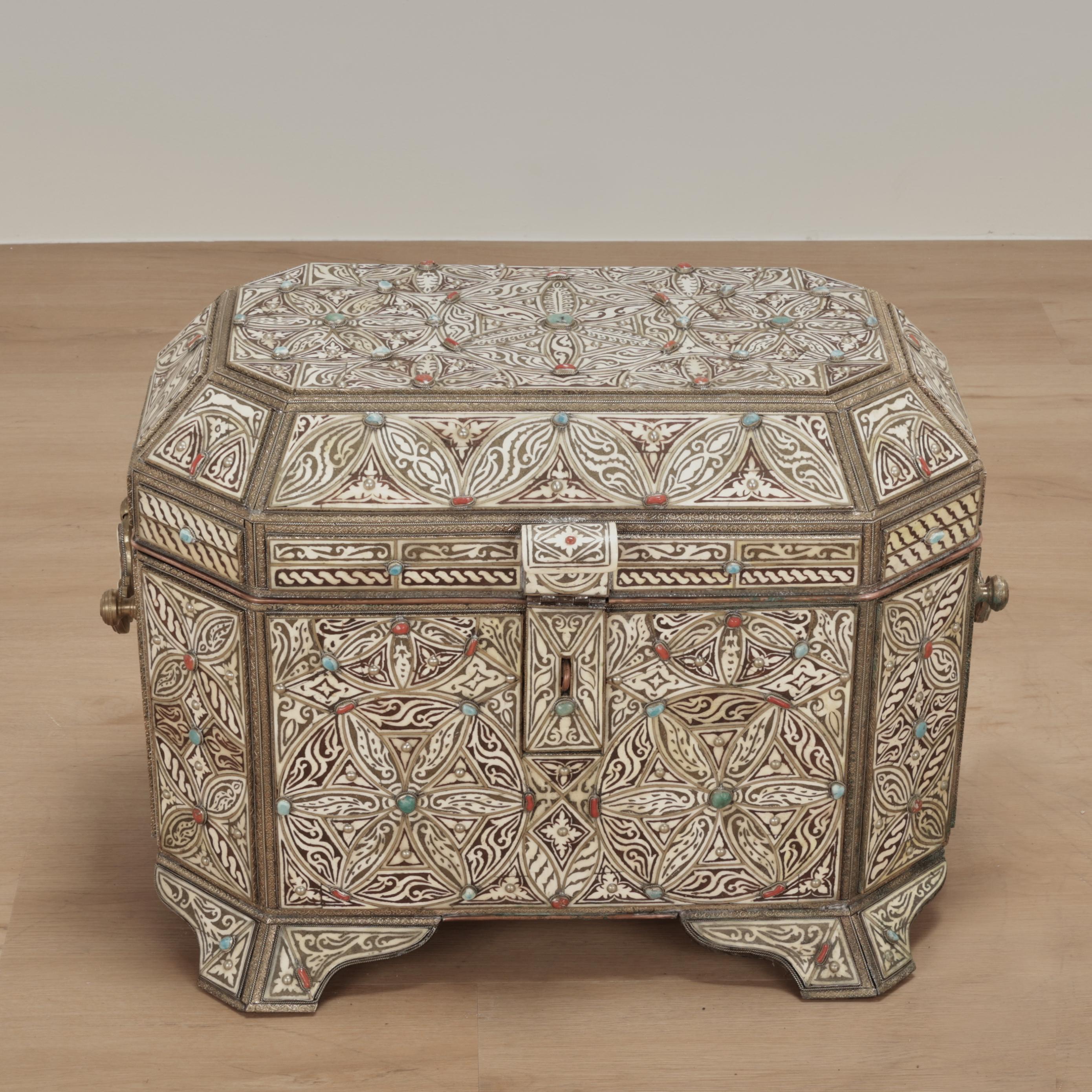 Enchanting antique large Turkish box crafted with bone, cut and decorated in floral compositions, hammered metalwork and highlighted with semi precious stones. The interior has multiple compartments lined with tooled and painted leather.
