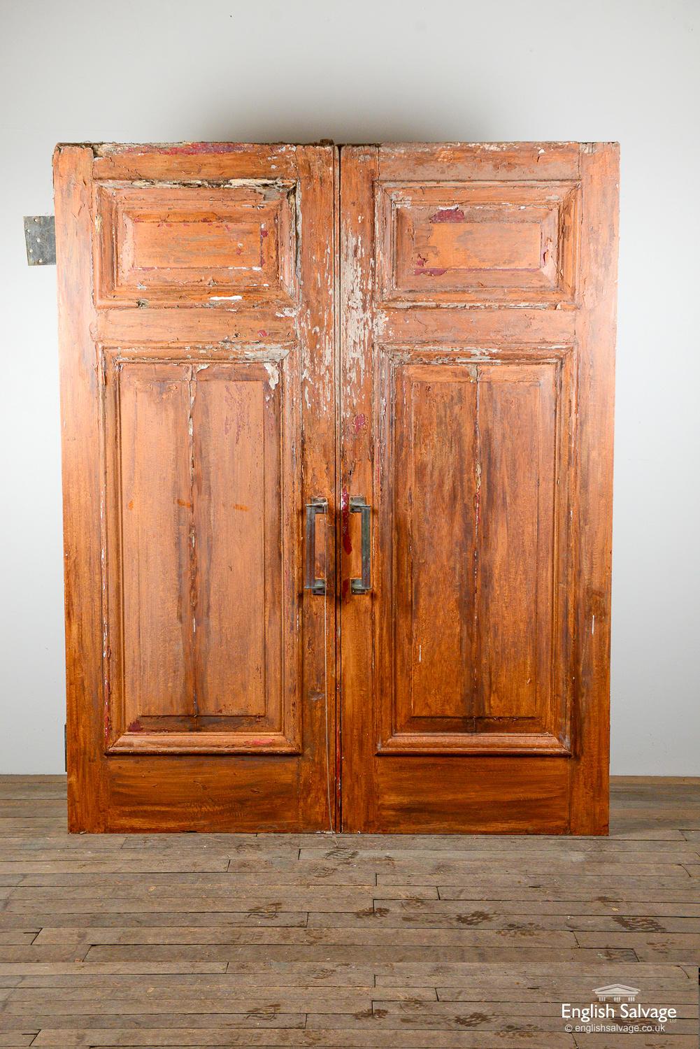 Reclaimed old oak double doors, each with two fielded panels. Overall width of double doors below, one door is 86.5cm wide and the other is 88cm. Some loss to corners and wear expected with age. Two large hinges and modern door pulls attached.