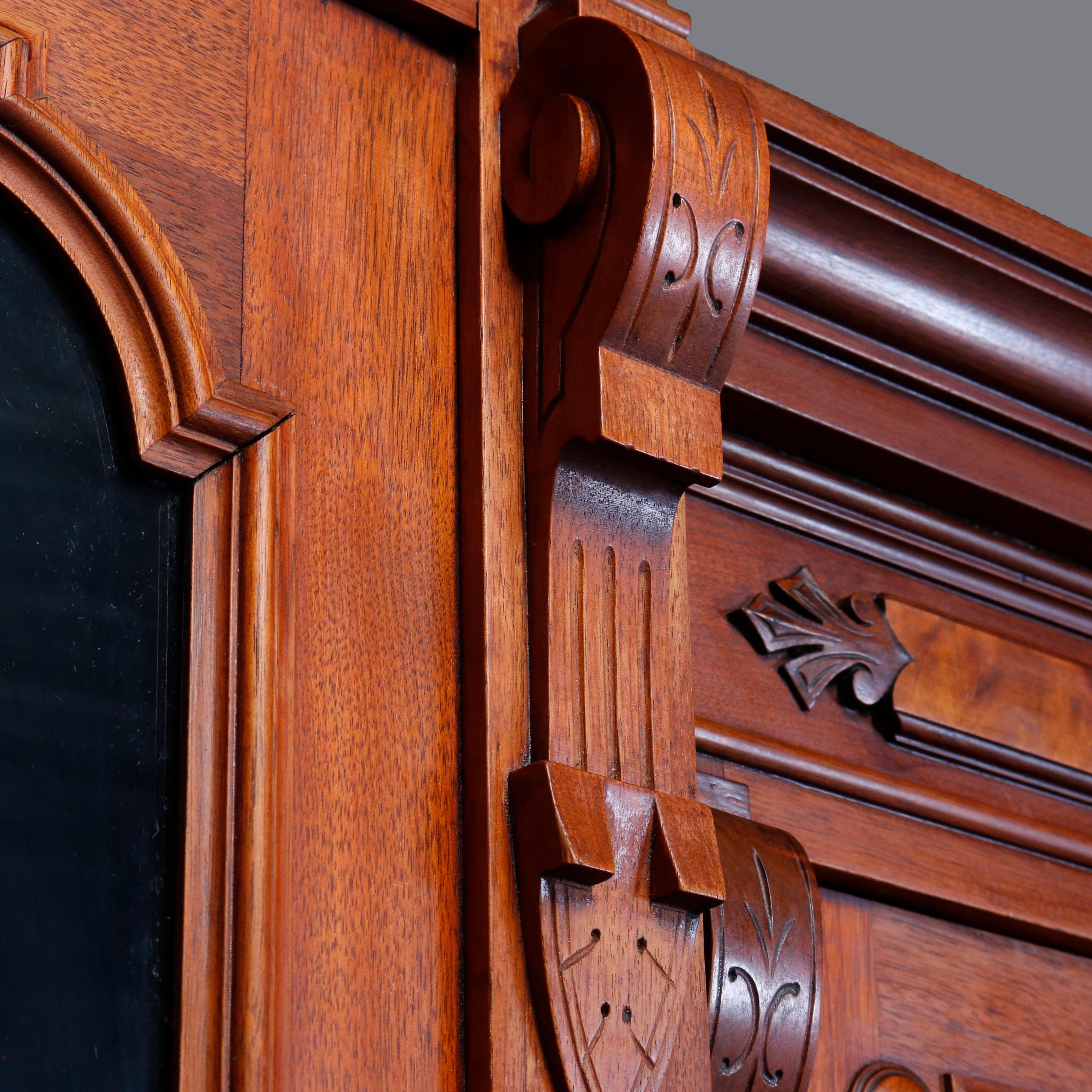 Eastlake Large Victorian Carved Walnut and Burl Enclosed 3-Section Bookcase, circa 1890