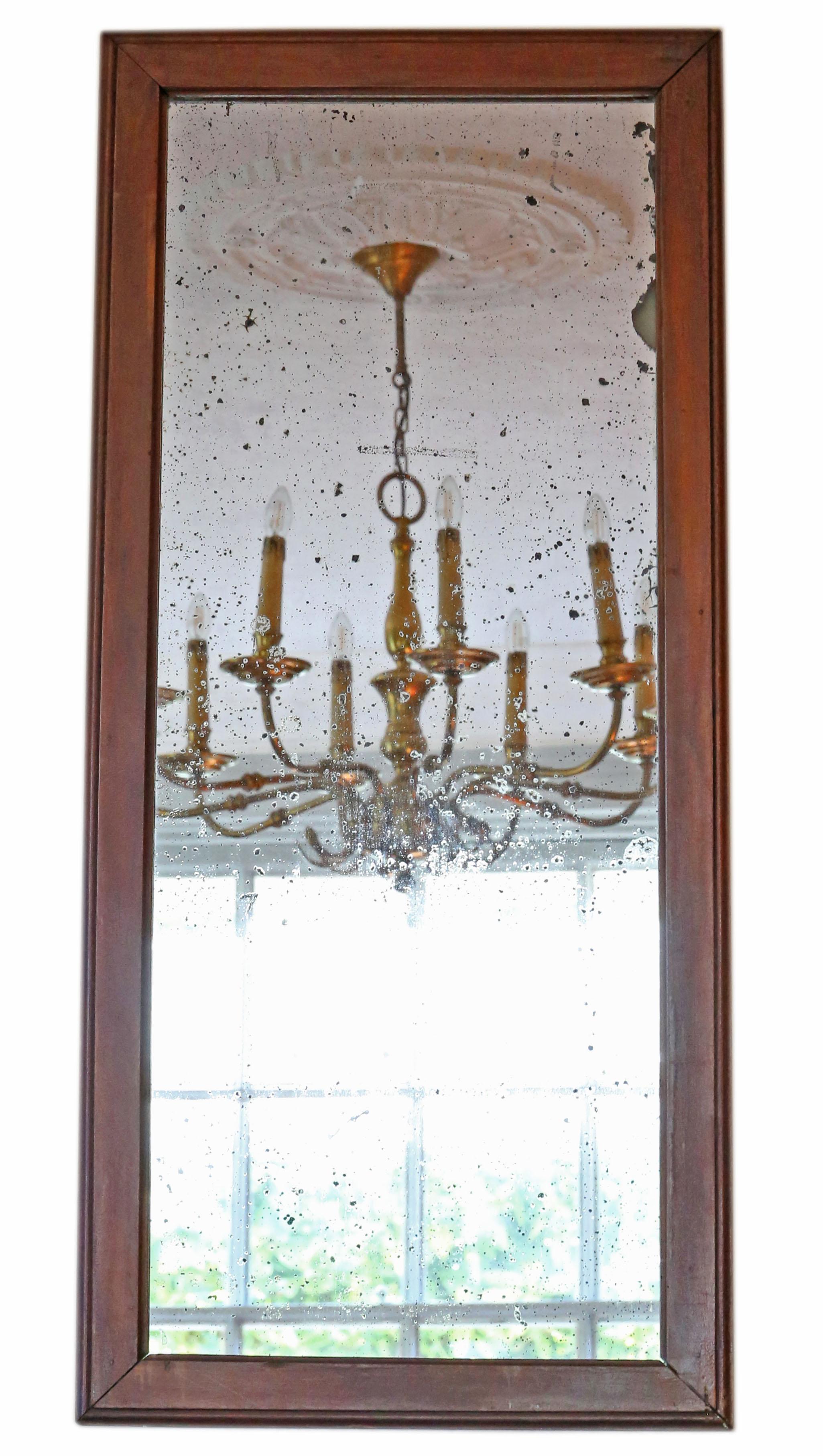 Antique large walnut overmantle or wall mirror, 19th century.

Would look amazing in the right location. No loose joints.

The mirrored glass has medium to heavy oxidation and other age related imperfections, however it still gives a sharp