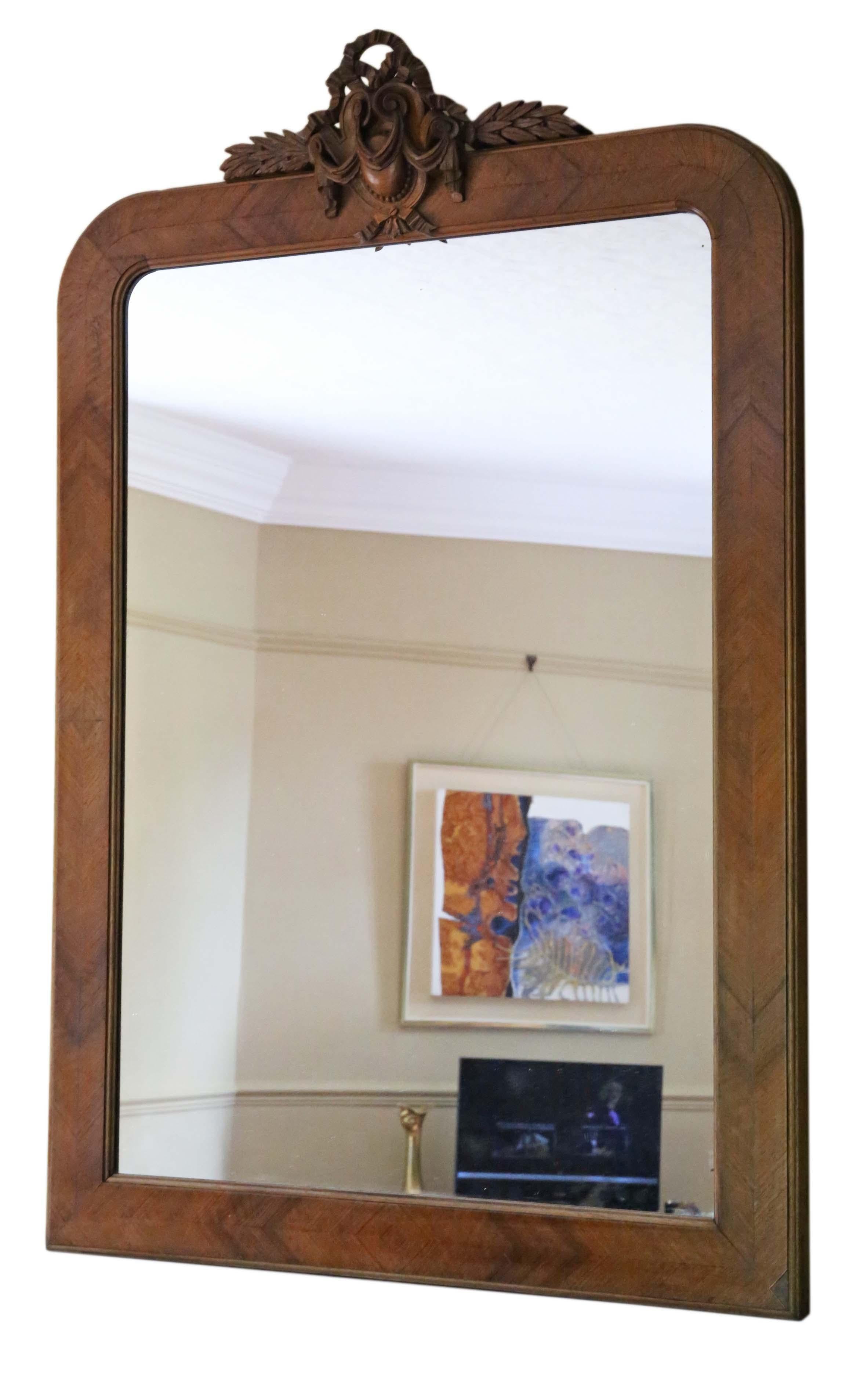 Antique large fine quality walnut overmantle wall mirror, circa 1900. Lovely charm and elegance, with a great carved crest.

An impressive and rare find, that would look amazing in the right location. No loose joints.

The mirrored glass has