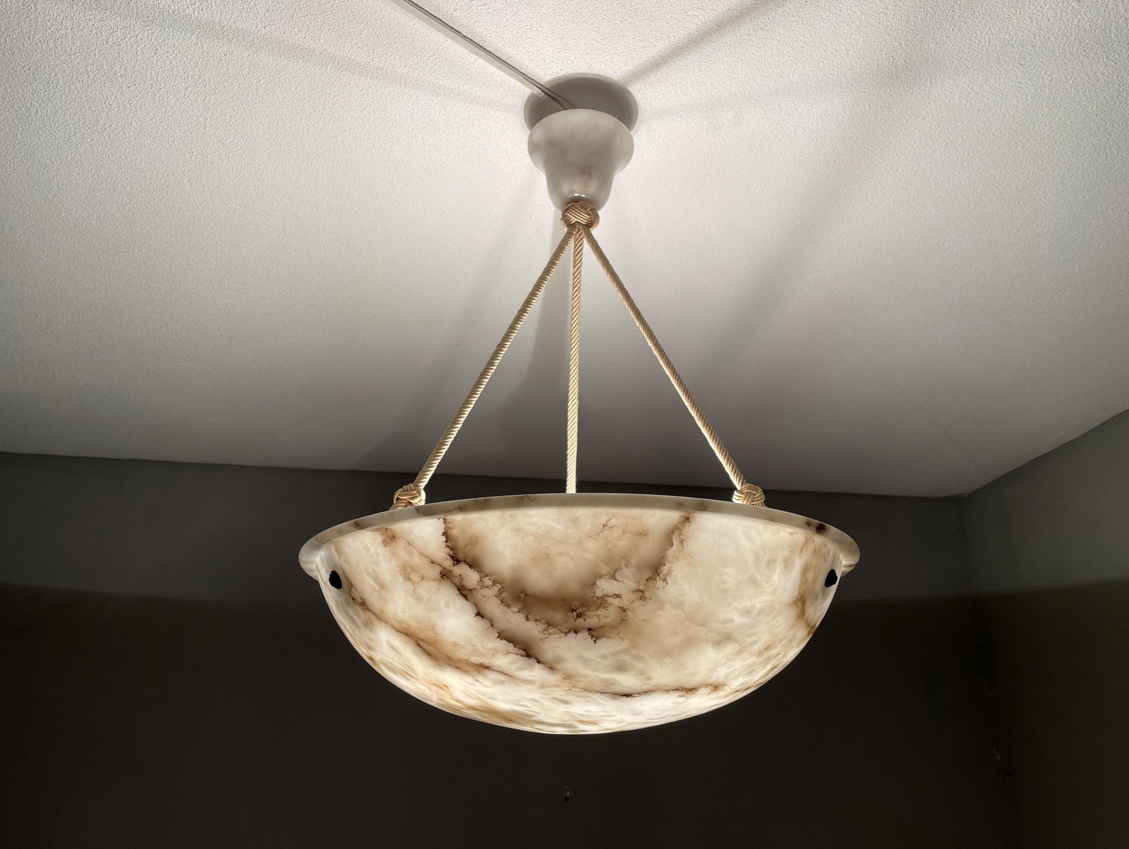 Top class antique pendant with a striking alabaster shade of 19.7 inches in diameter.

Thanks to its large size and excellent condition this timeless alabaster chandelier is bound to light up someones days and evenings soon. Because of their