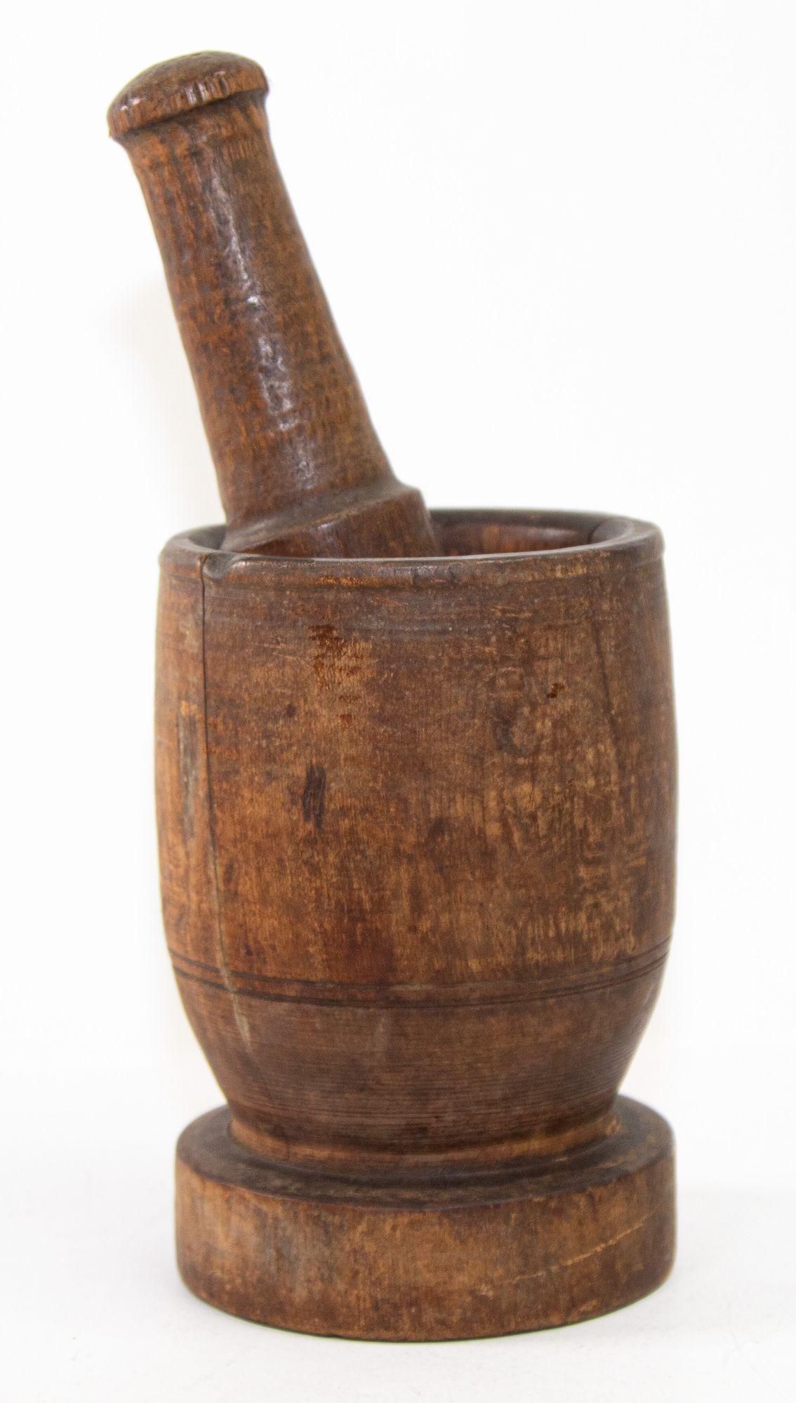 Large wood antique American mortar and pestle.
Early rare turned wood footed mortar and pestle.
American, late 19th century wooden mortar and pestle.
The urn shaped mortar with rich patina has a wonderful warmth and feel.
The base being
