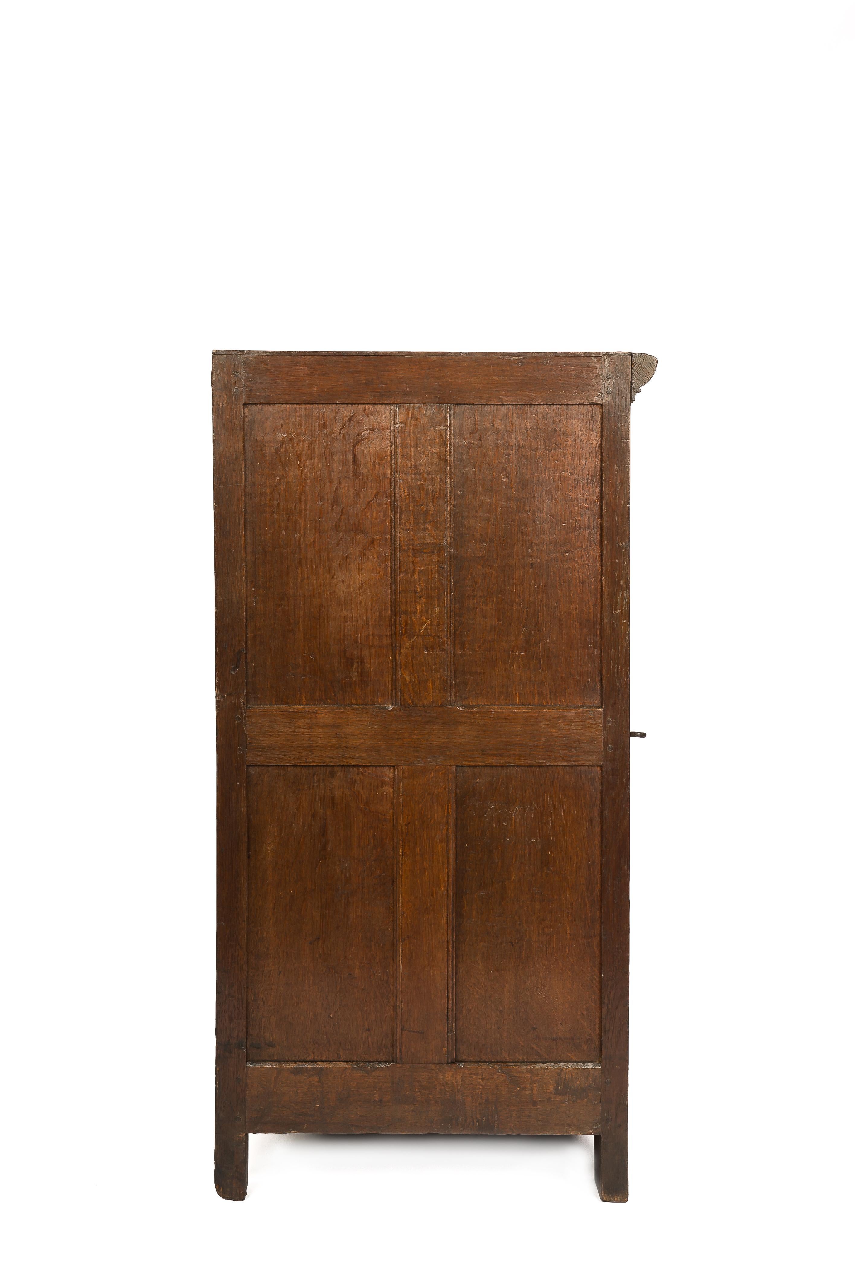 This elegant single-door cabinet was made in the Southern part of the Netherlands in the late 17th century. It was made in the best quality quarter-sawn oak in the tradition of the Dutch Renaissance during the “Dutch golden age”. The piece is of