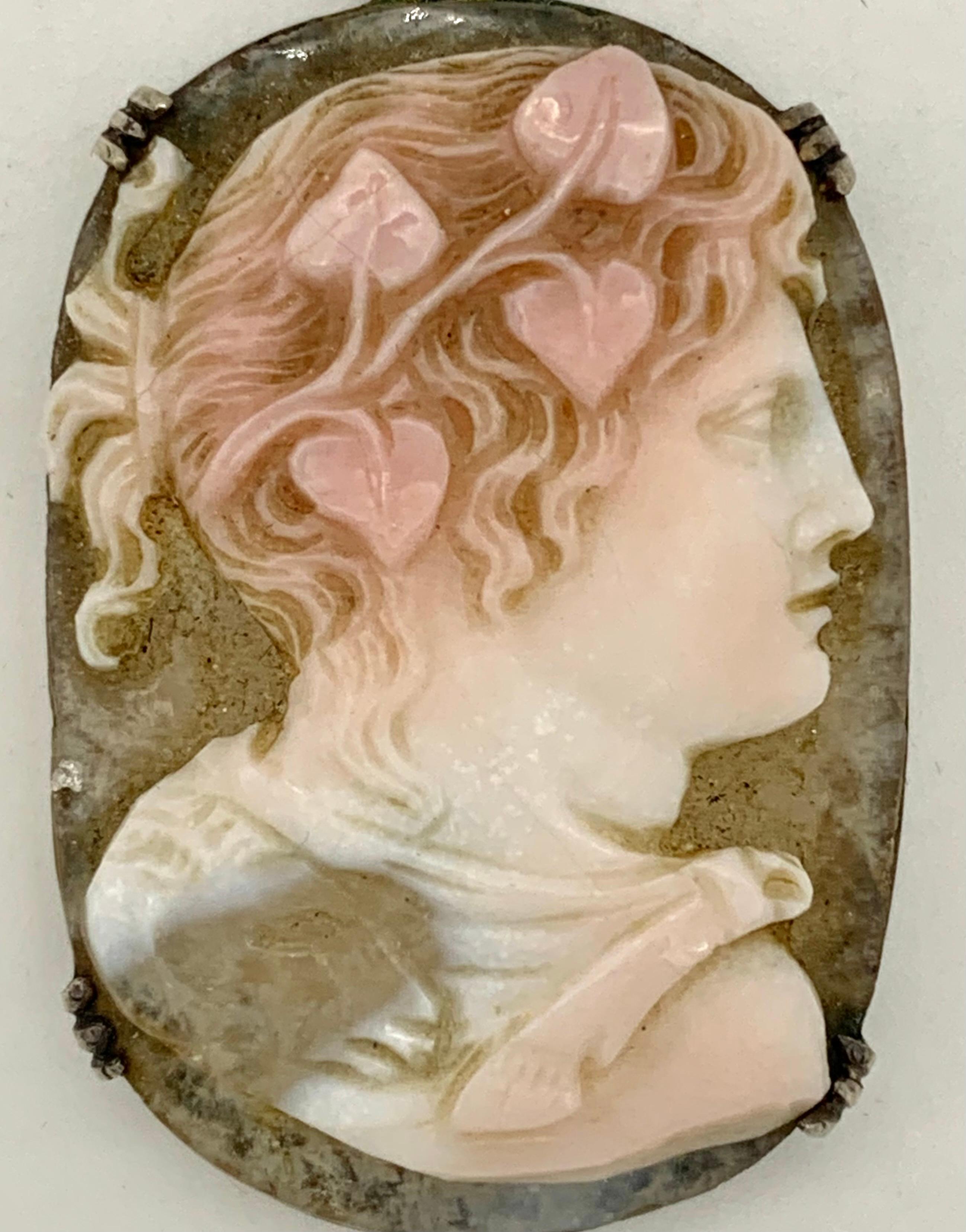 This fine hardstone cameo depicts a woman or men wearing a wreath of ivy. In Greek and Roman mythology the ivy wreath worn around head was the attribute of a followers of  Dyonisos and Baccus, the gods of wine , ecstasy and fertility. The cameo was