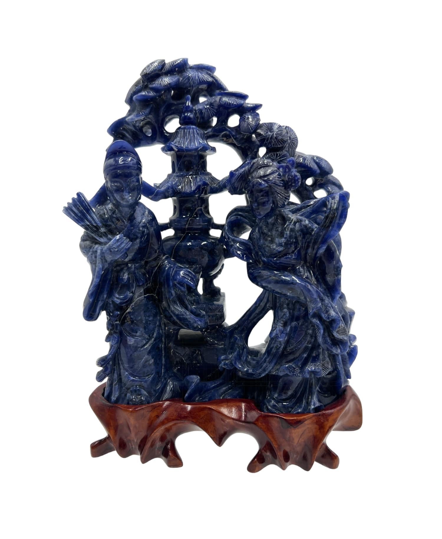 An exquisitely carved Lapis Lazuli figurine depicting an Emperor and Empress in the style of the late Ming to early Qing Dynasty.

Crafted from genuine Lapis Lazuli, a rare and precious gemstone revered for its deep blue hue and natural variations,