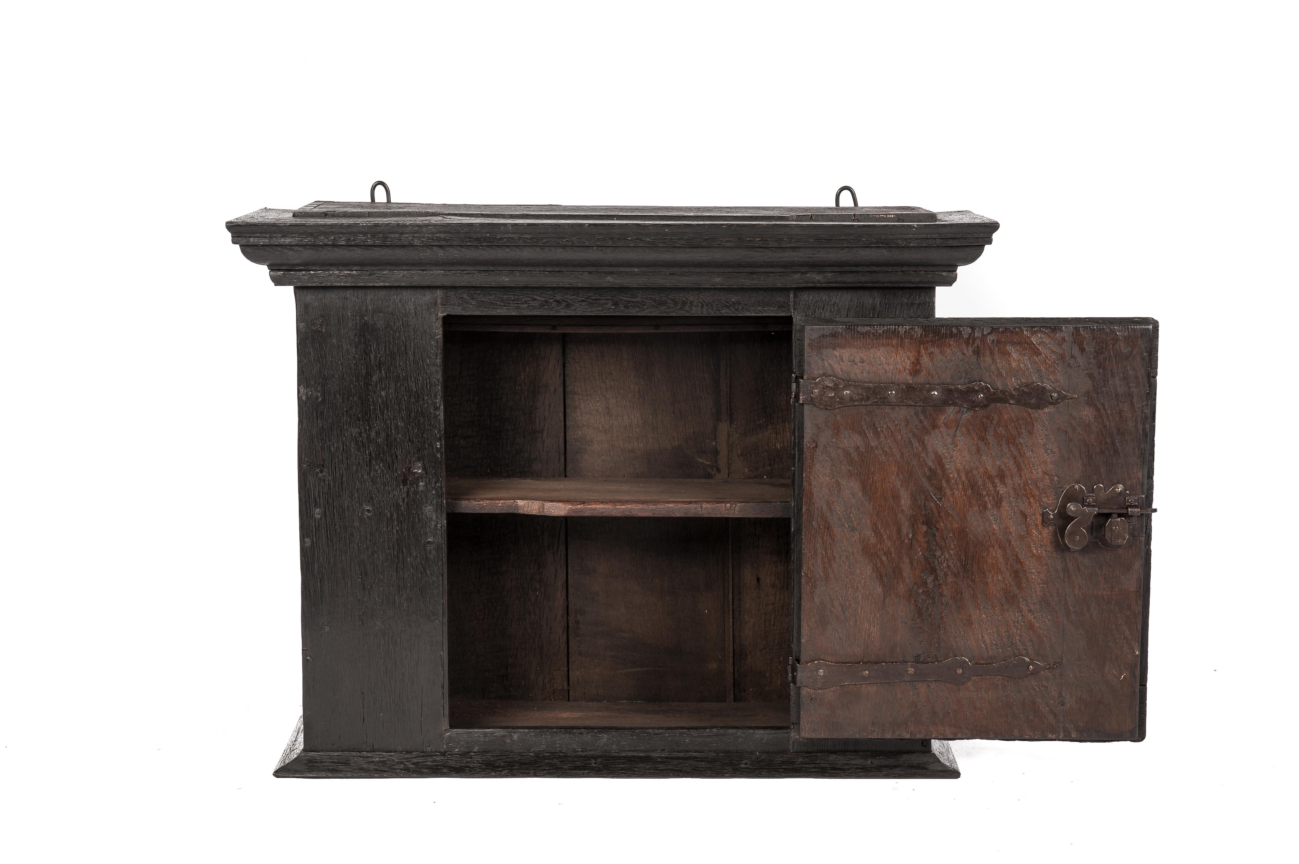 Antique Late 18th Century German Solid Black Oak Wall Hanging Cabinet In Good Condition For Sale In Casteren, NL