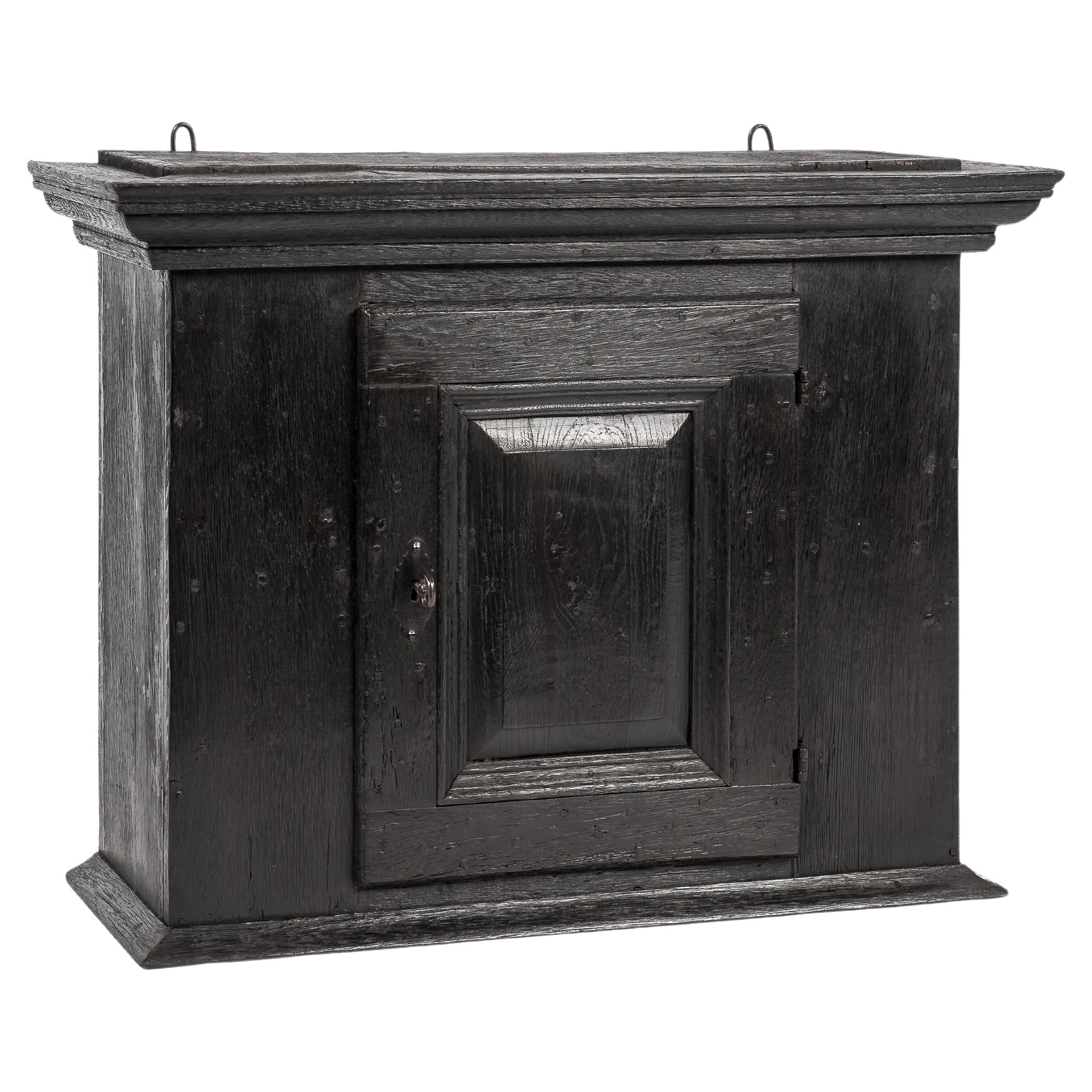 Antique Late 18th Century German Solid Black Oak Wall Hanging Cabinet For Sale