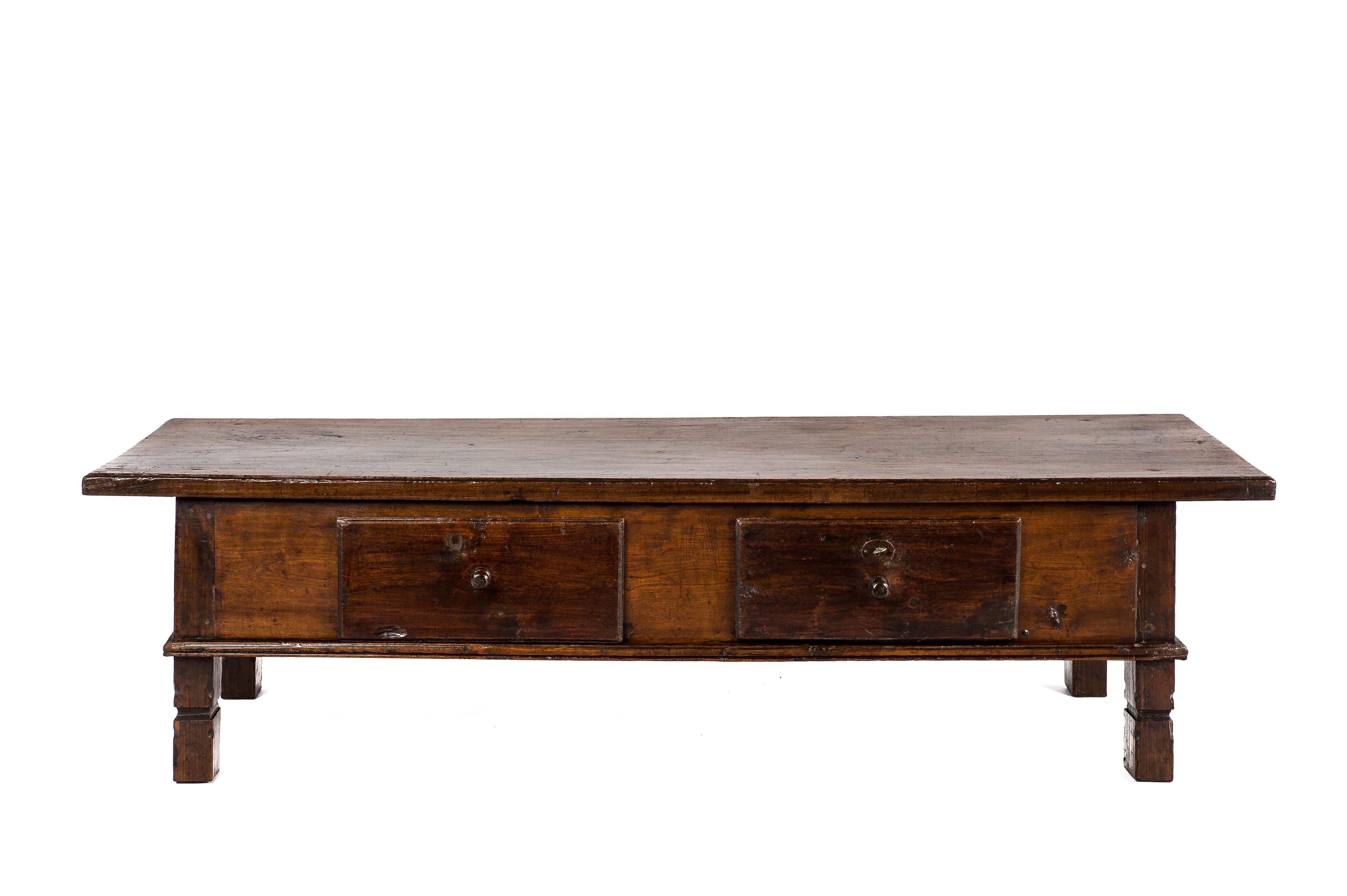 This beautiful warm brown color rustic coffee table or low table originates in rural Spain and dates circa 1780. The table has a unique top that was made from a single board of solid chestnut wood that is 1.6 inches thick and features molding at the