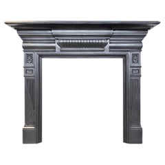 Antique late 19th century cast iron fireplace surround