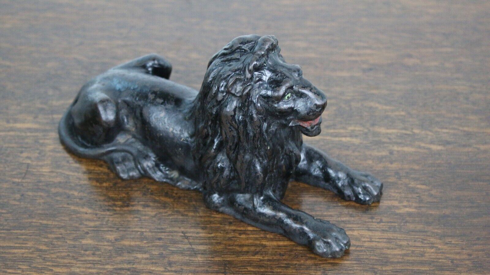 Cast Lion

A fabulous 19th century Black Lion.

A recumbent cast lion suitable for the desk or as a feature on a bookcase.

Casting stamp underneath.

Condition:

In original antique condition.