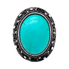 Ancienne bague cabochon ovale en turquoise chinoise de la fin du XIXe siècle