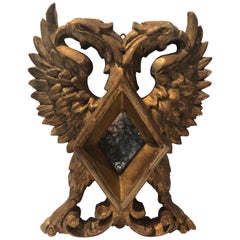 Miroir ancien en bois doré de la fin du XIXe siècle avec griffons