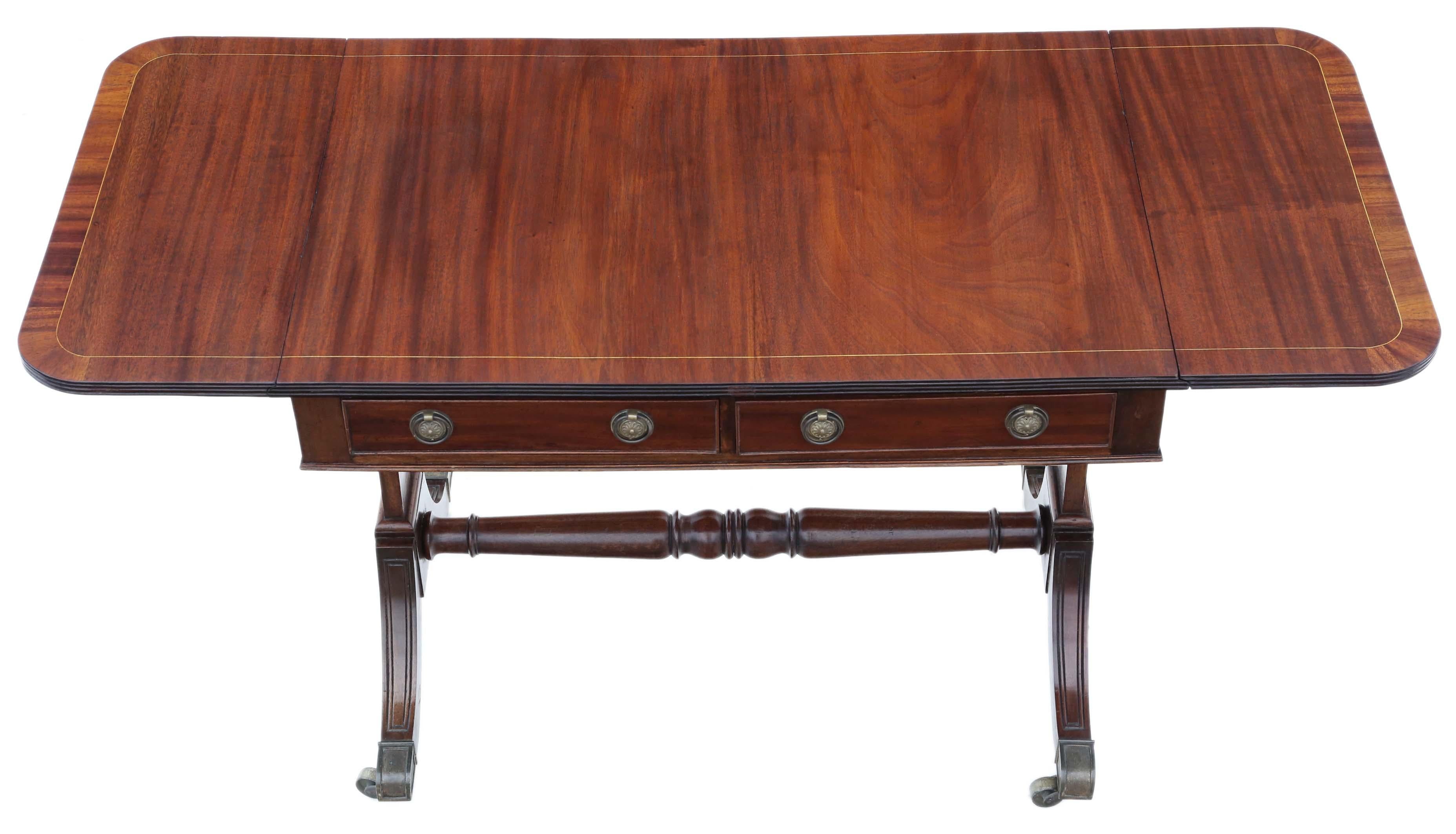 Antique late 19th century Georgian / Regency Revival inlaid mahogany folding sofa table.

Would also make a great desk, lamp, side, console or occasional table.

It is rare to find this kind of extending table, with the large sofa width (as