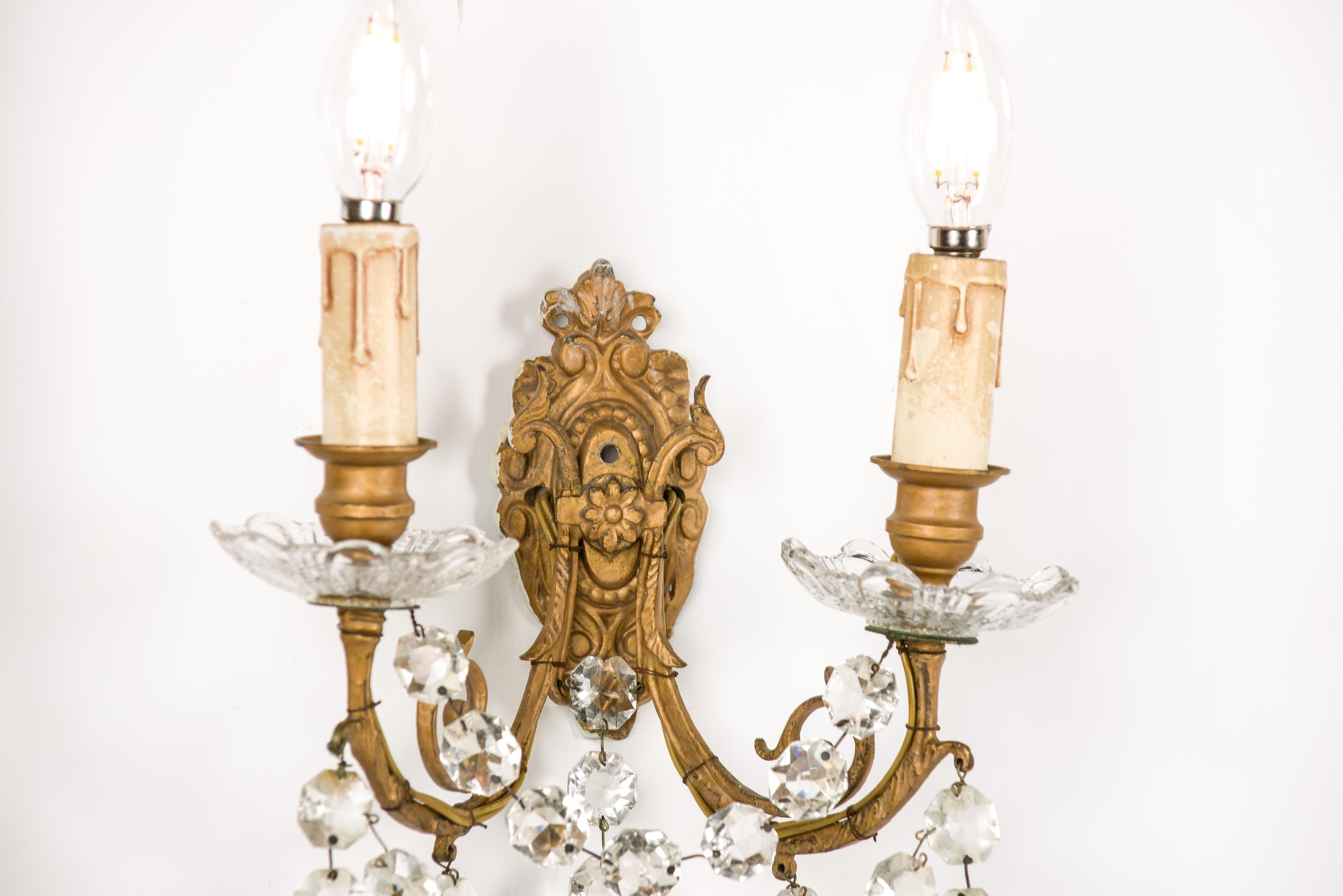 Patinated Antique late 19th century pair of brass and baccarat crystal wall sconces