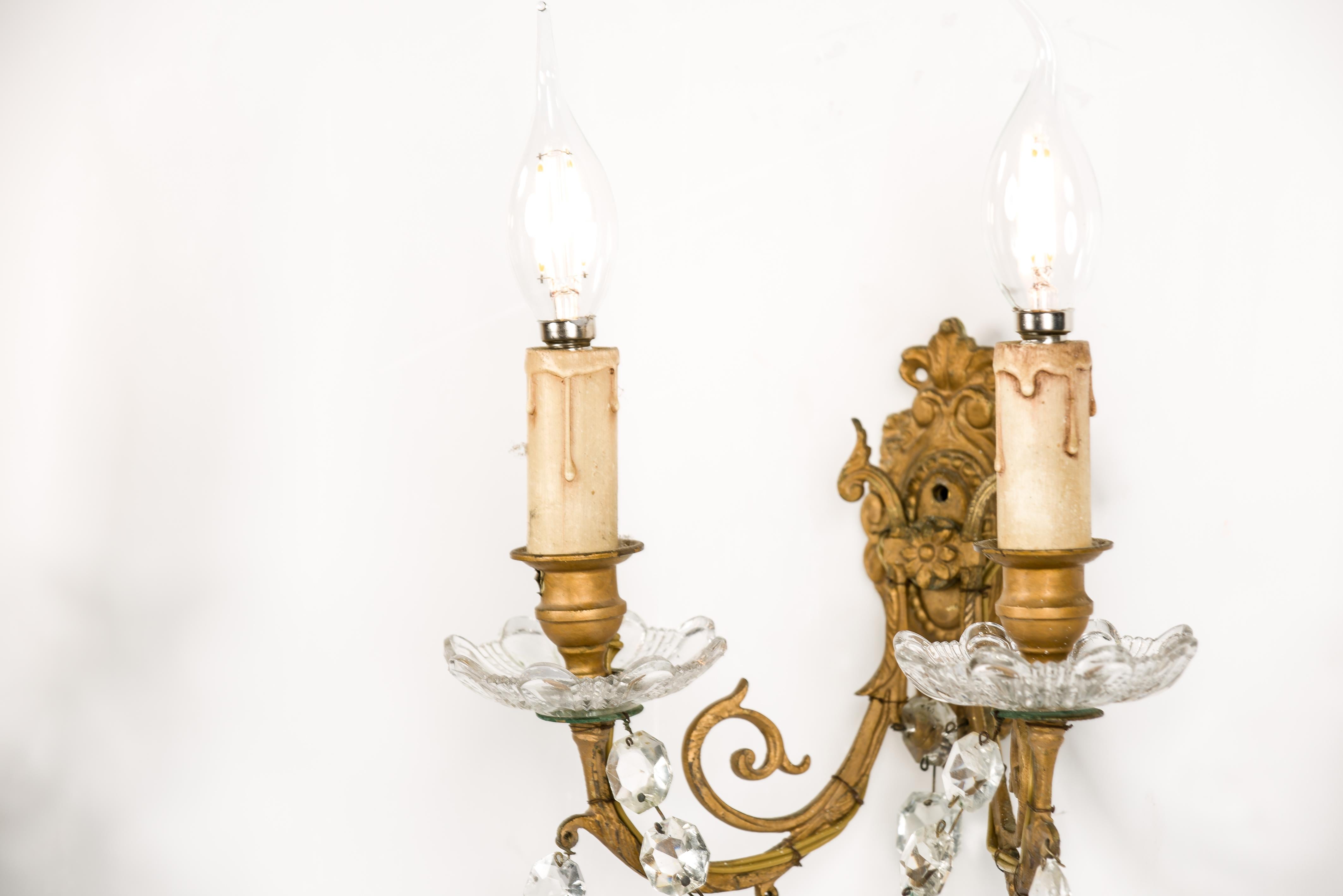 Brass Antique late 19th century pair of brass and baccarat crystal wall sconces