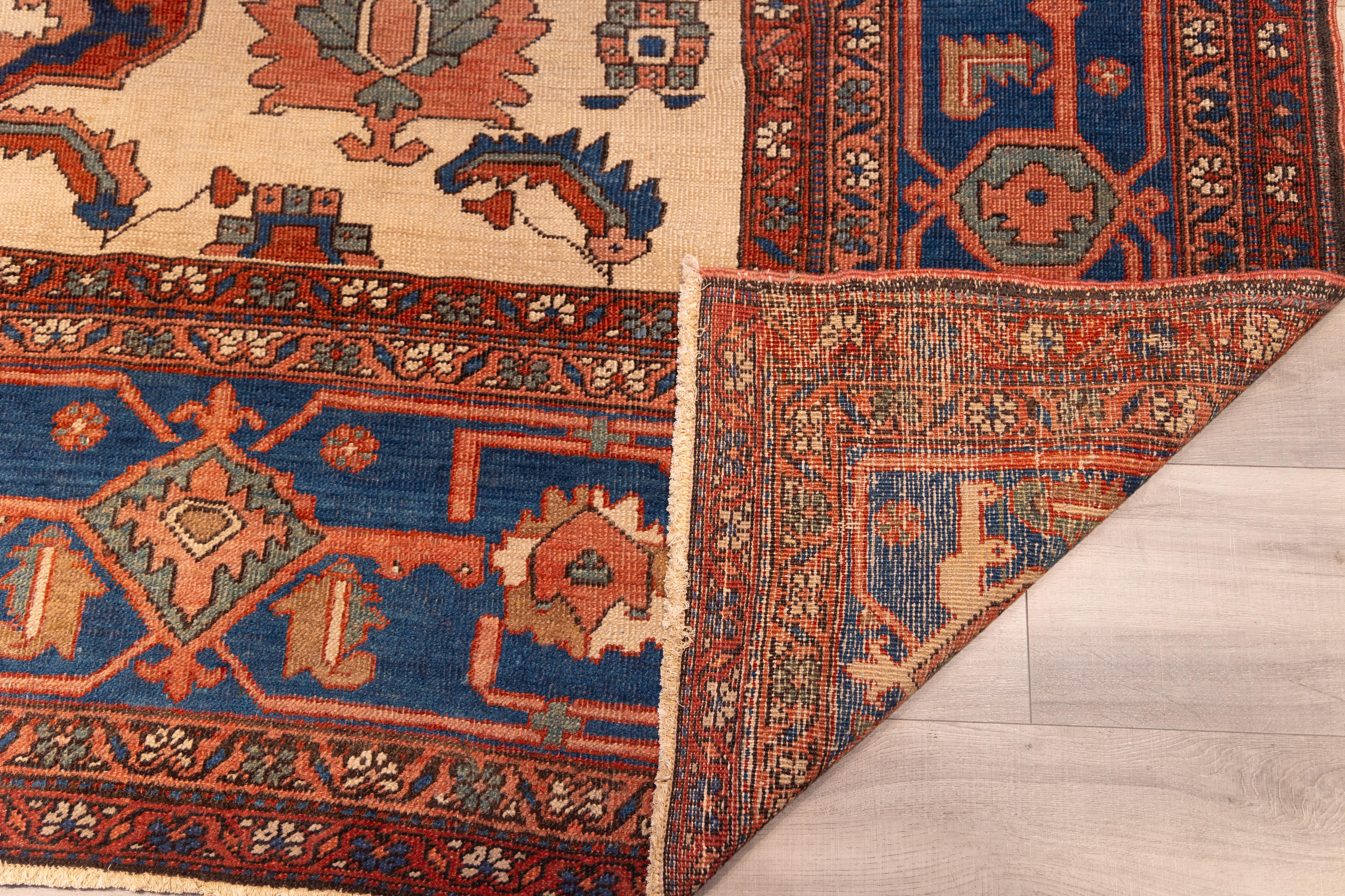 Persian Antique Late 19th century tribal serapi rug For Sale
