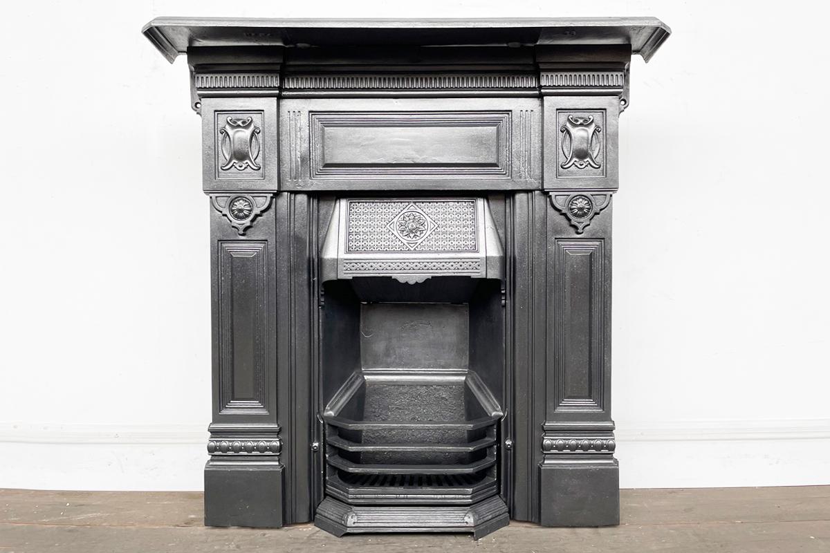 Antique late 19th Century Victorian cast iron combination fireplace. Dated 1893-1897. Finished in traditional black grate polish.

For detailed sizes please see the size diagram in the image gallery.

We currently have a pair of these fireplaces