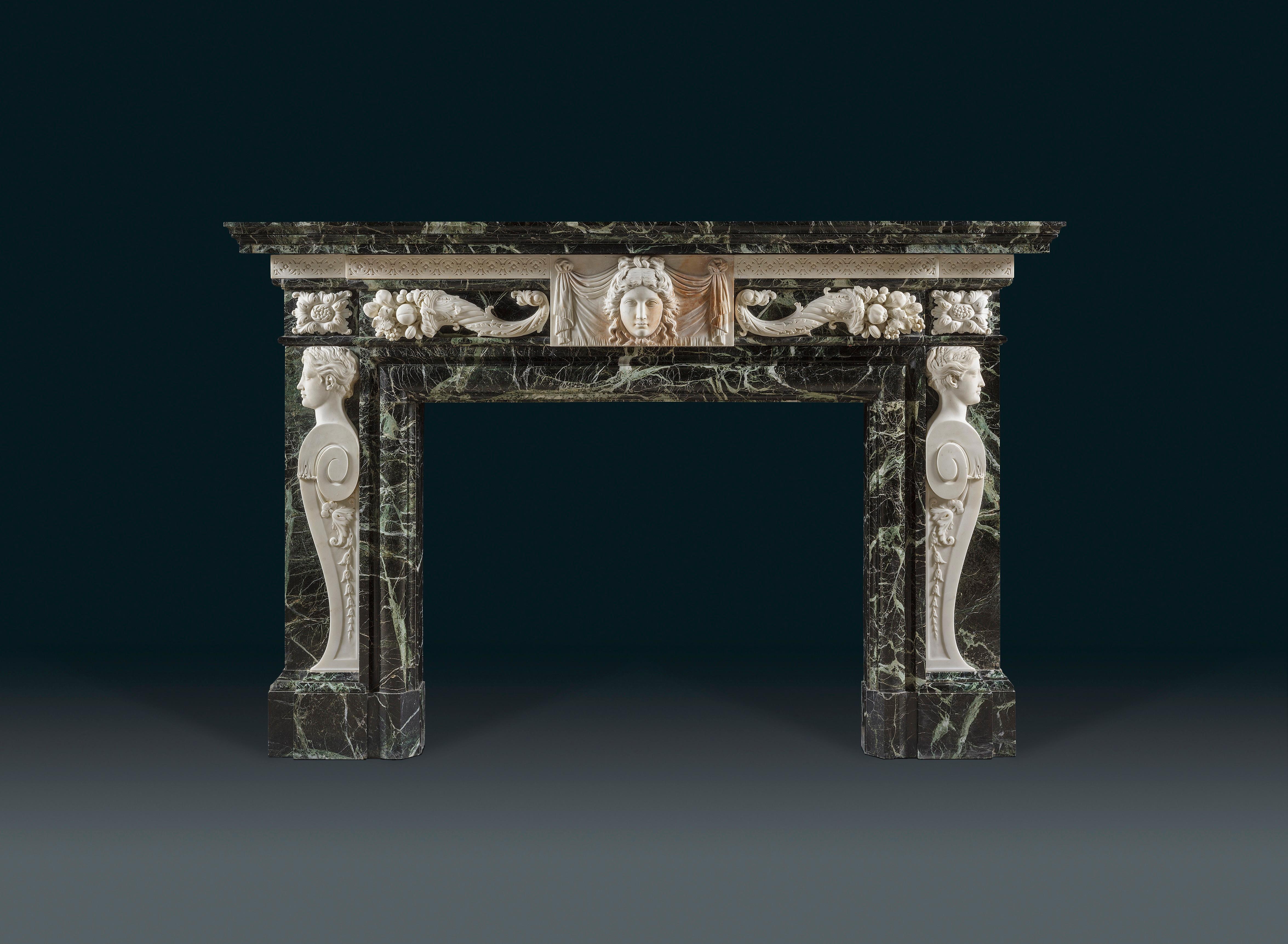 The deep rectangular breakfront shelf above a band of stylized rosettes centered by a high relief-carved tablet of a drapery hung classical female mask, the frieze with overlaid cornucopia to the sides, the aperture surrounded by a cushion moulding,