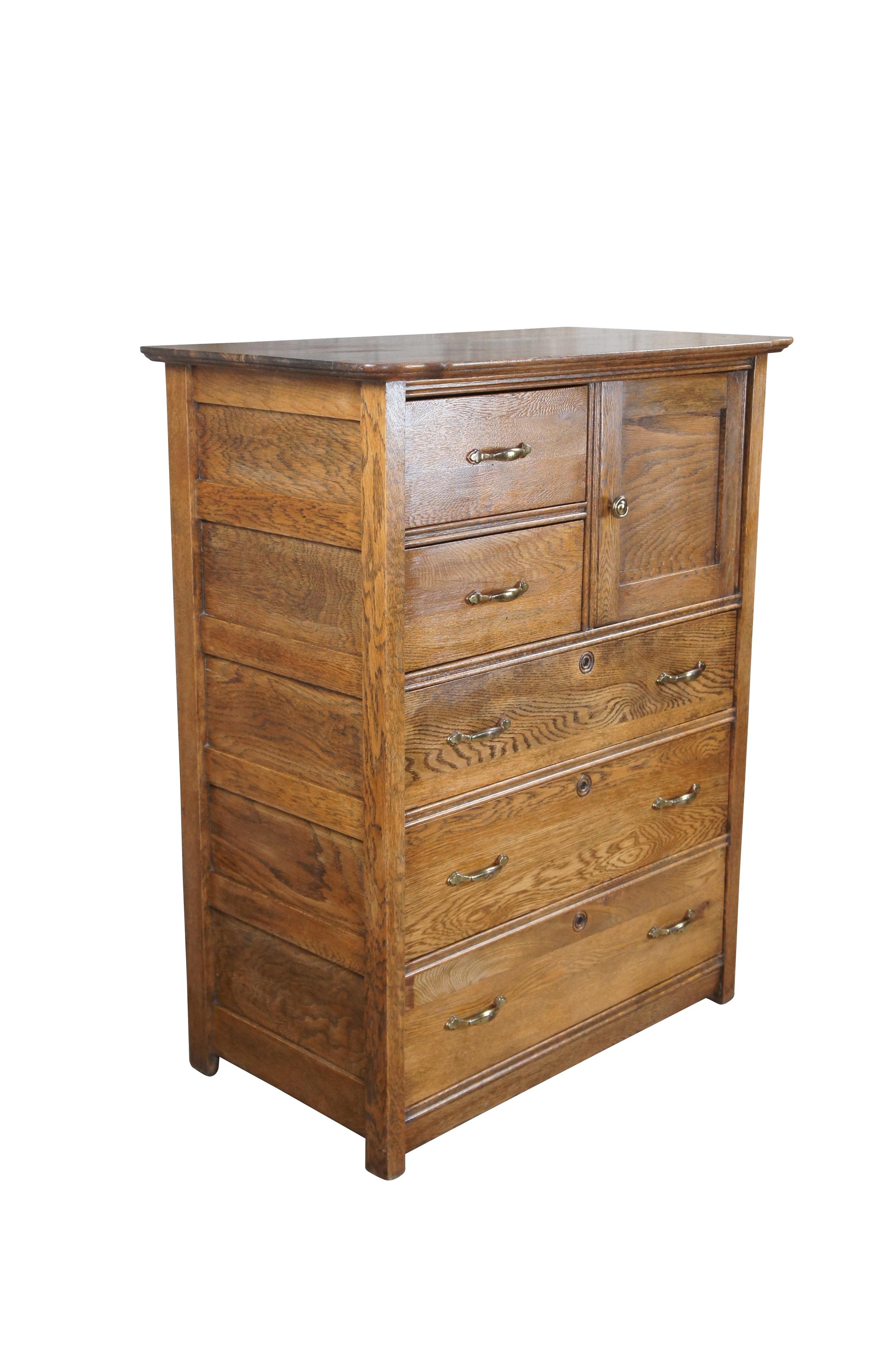 American Victorian Tallboy dresser, circa 1900s.  Made from oak with five drawers and side cubby.  Features paneled siding and brass hardware.  

Dimensions:
18