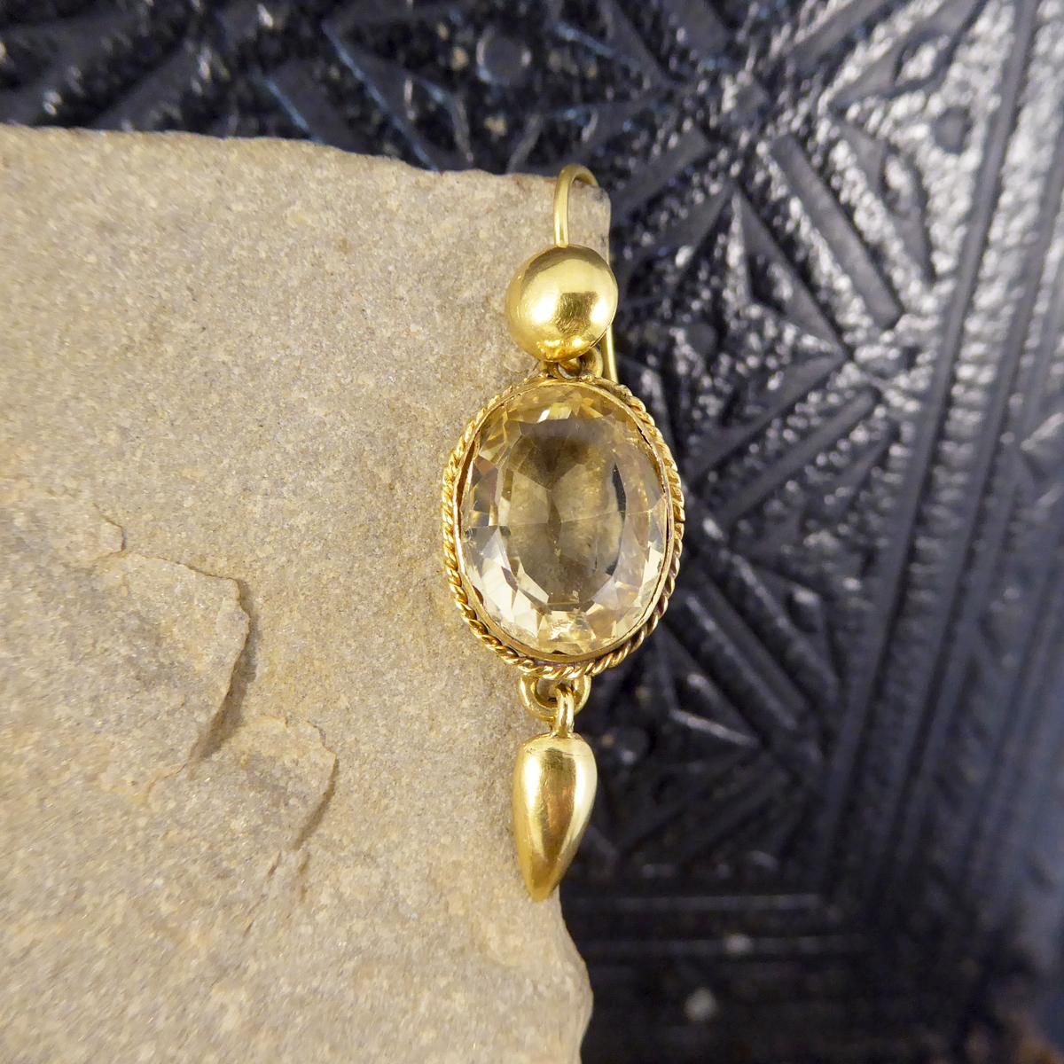 These antique earrings date to the Late Victorian period. They each feature a Citrene with a drop at the top and bottom in 18ct Yellow Gold with gold hooks, and look very compelling on the ear! 

Condition: Good, slight signs of wear on the stones