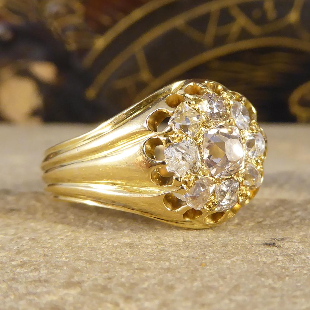 A traditional Victorian Diamond cluster ring from the late 18th century. Hand crafted from 18ct Yellow Gold, the ring features a 9 stone cluster of old cut Diamonds. Each Diamond is completely unique due to having been individually hand cut. The